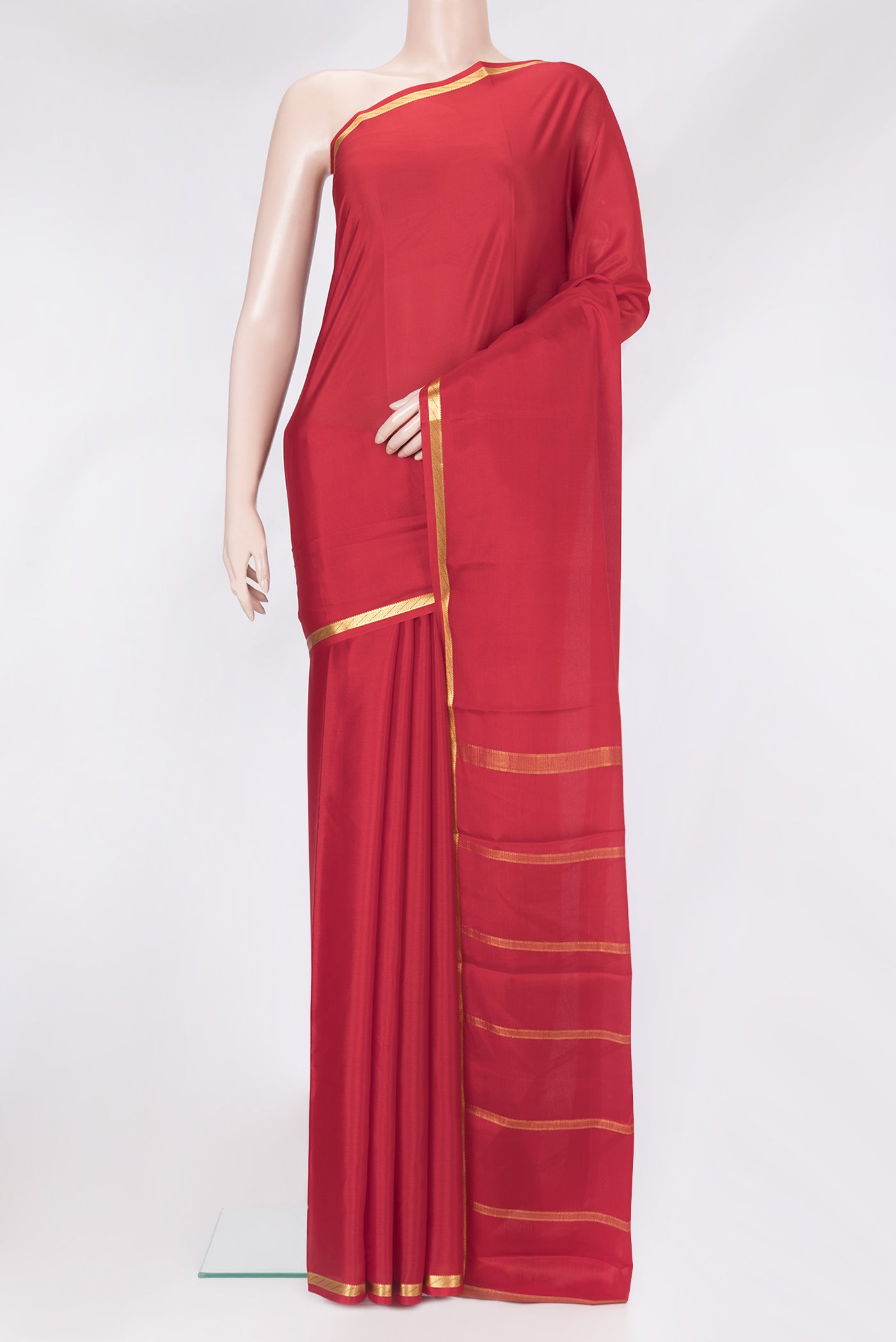 Red Mysore Crepe Saree with Plain Body and Zari Border.  displayed on a mannequin