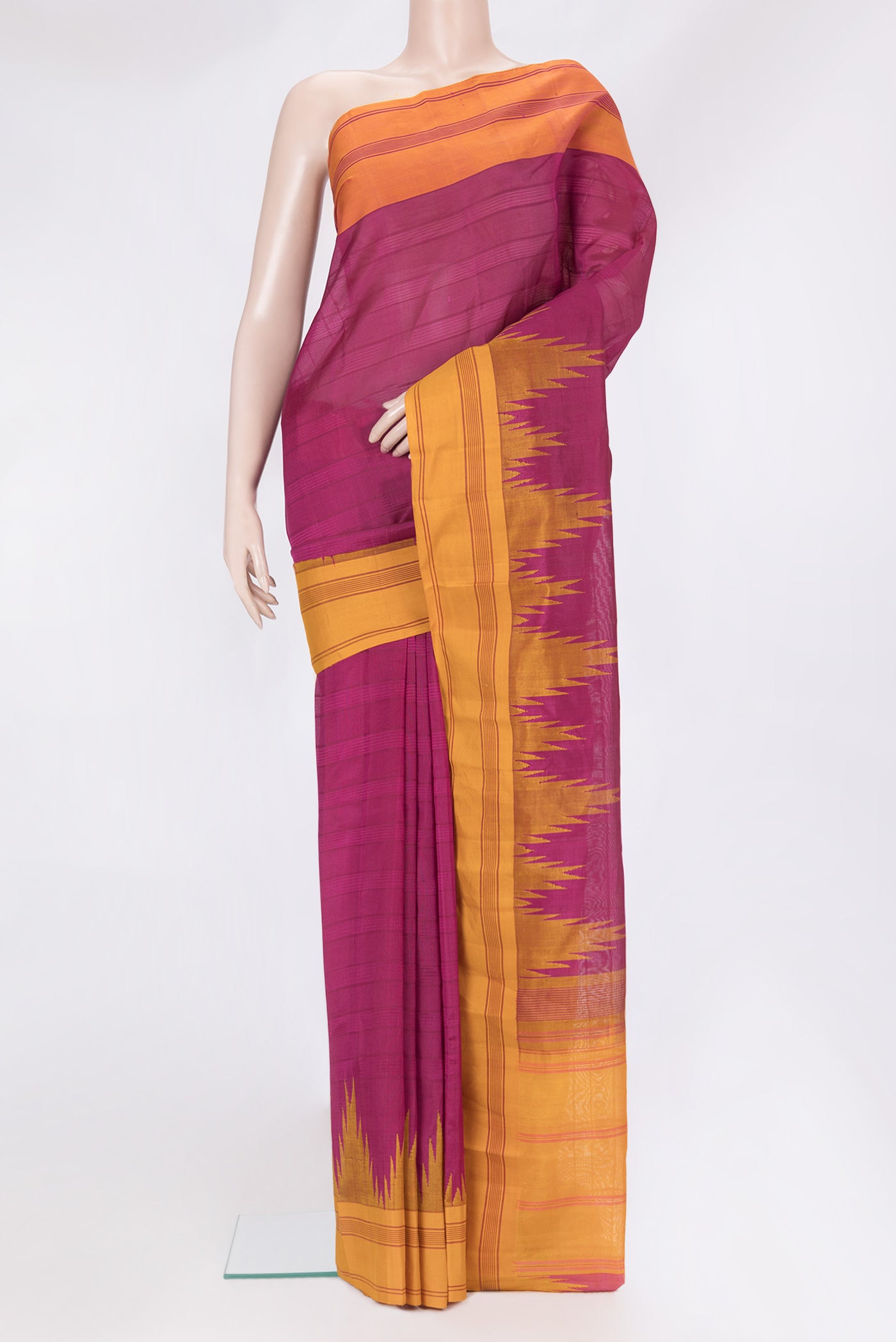 Magenta Kanchi Cotton Saree with Stripes on the body and Temple Border.  displayed on a mannequin