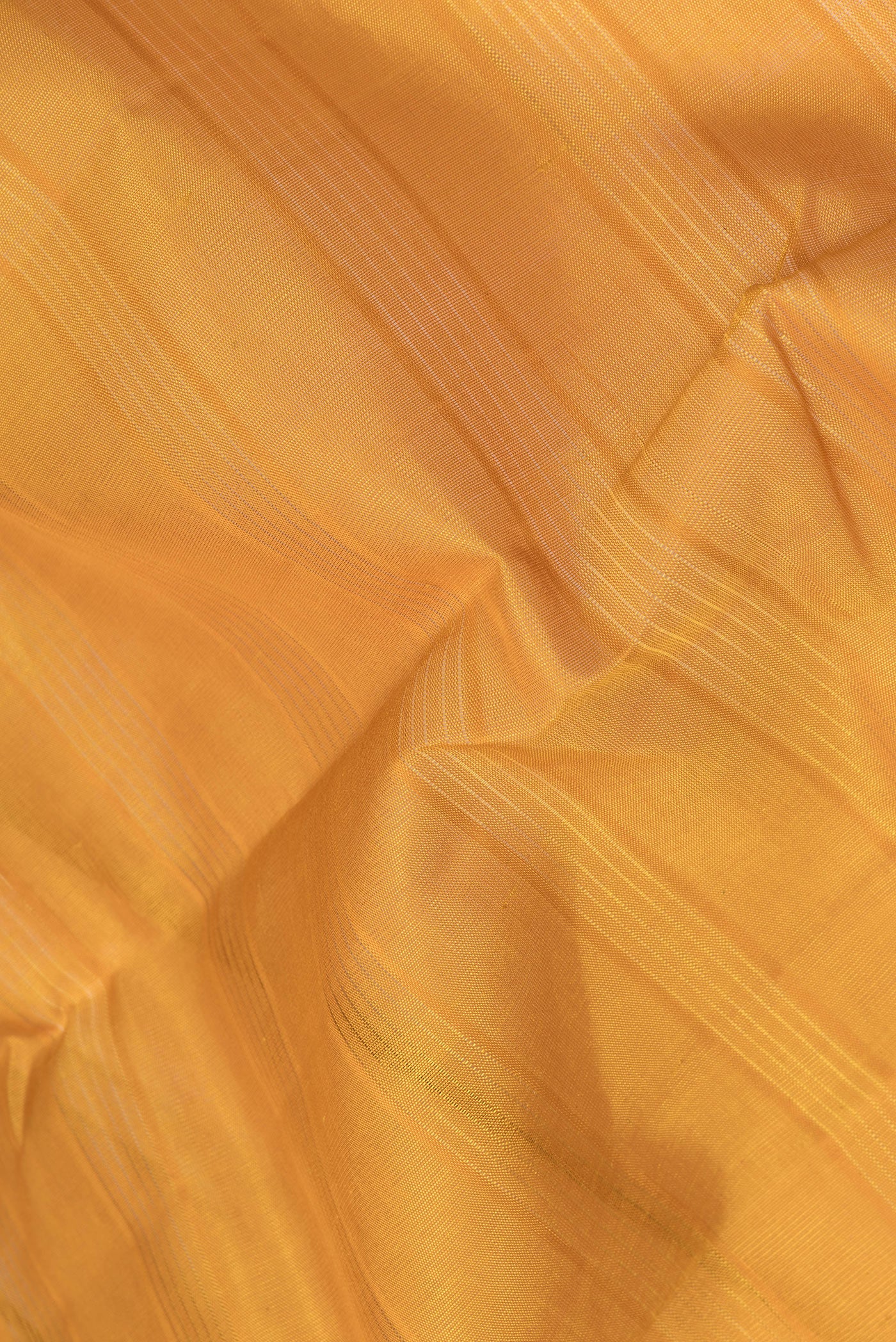 Close up of Yellow Kanchi Cotton Saree with Stripes on the body and Temple Border.  displaying folds