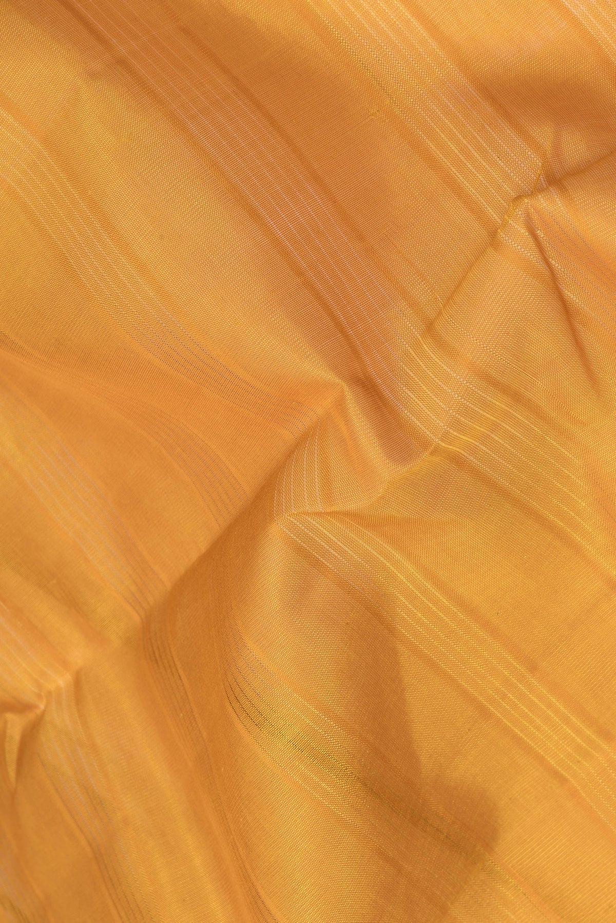 Close up of Yellow Kanchi Cotton Saree with Stripes on the body and Temple Border.  displaying folds
