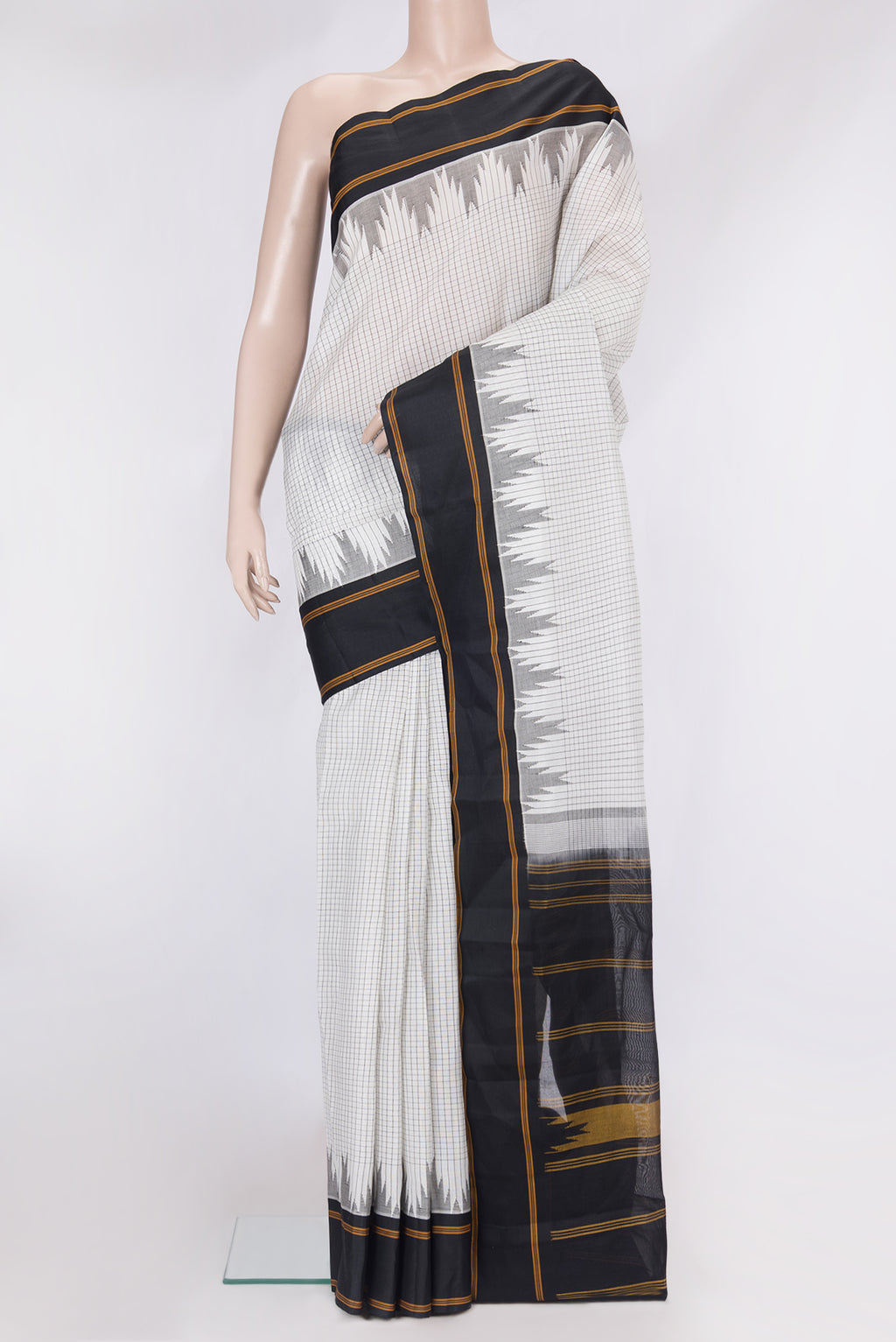 White Kanchi Cotton Saree with Checked design on the body and Temple Border.  displayed on a mannequin