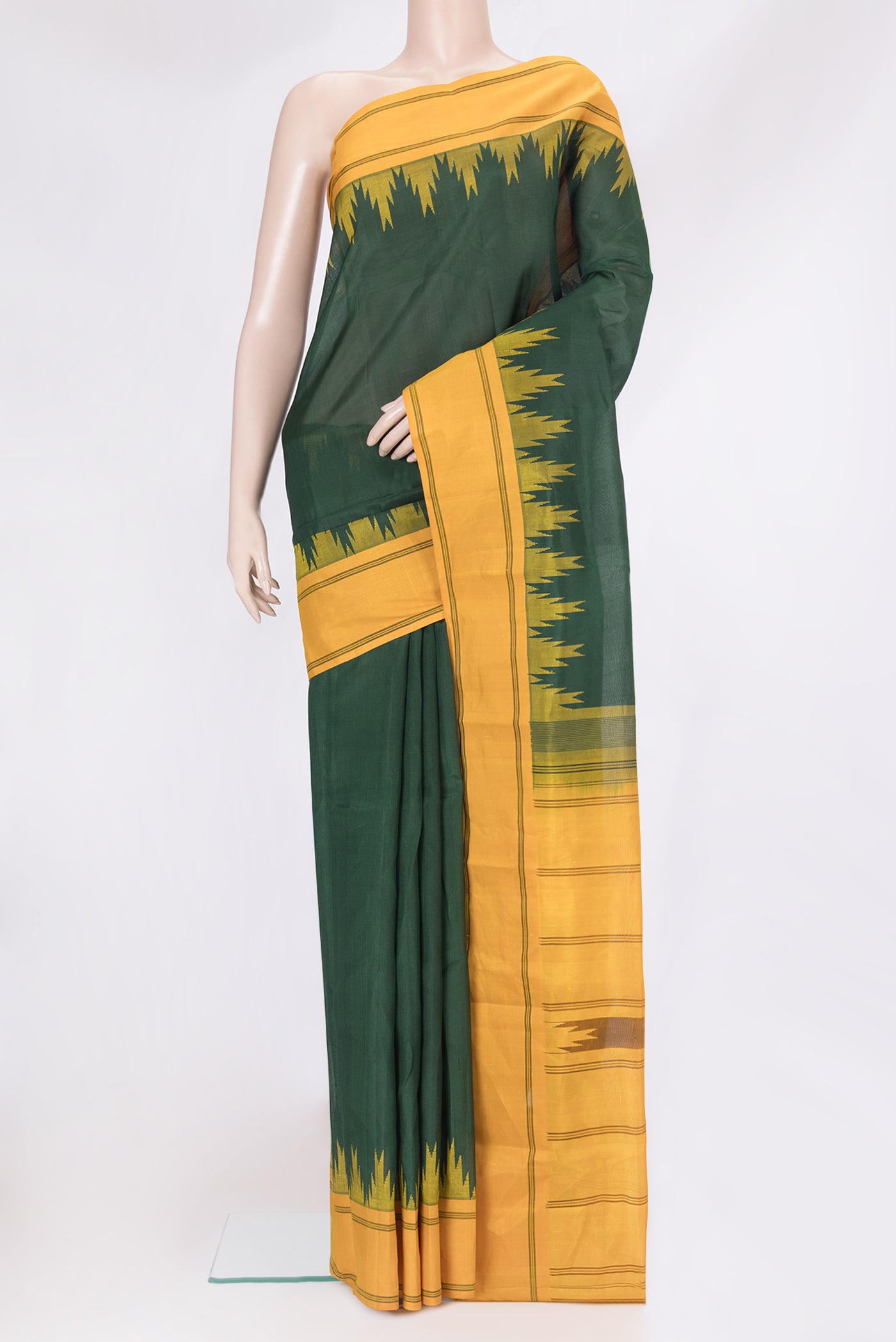 Bottle Green Kanchi Cotton Saree with Plain Body and Temple Border.  displayed on a mannequin