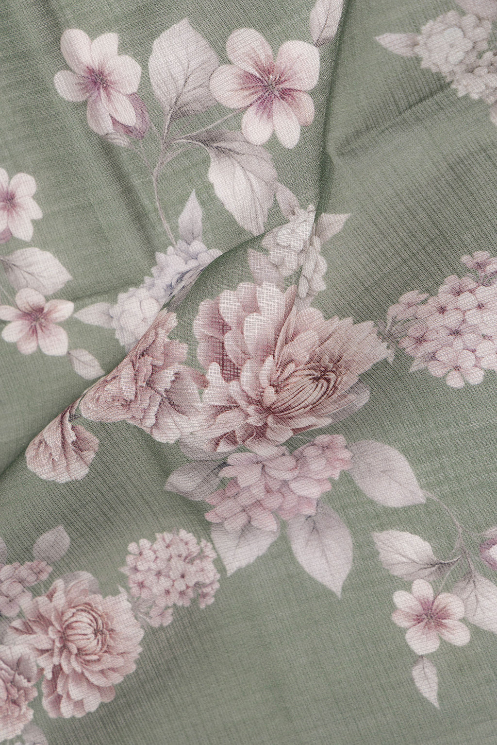 Close up of Pure Silk Green Kota Saree with Floral Print on the body and Thread Border.  displaying folds