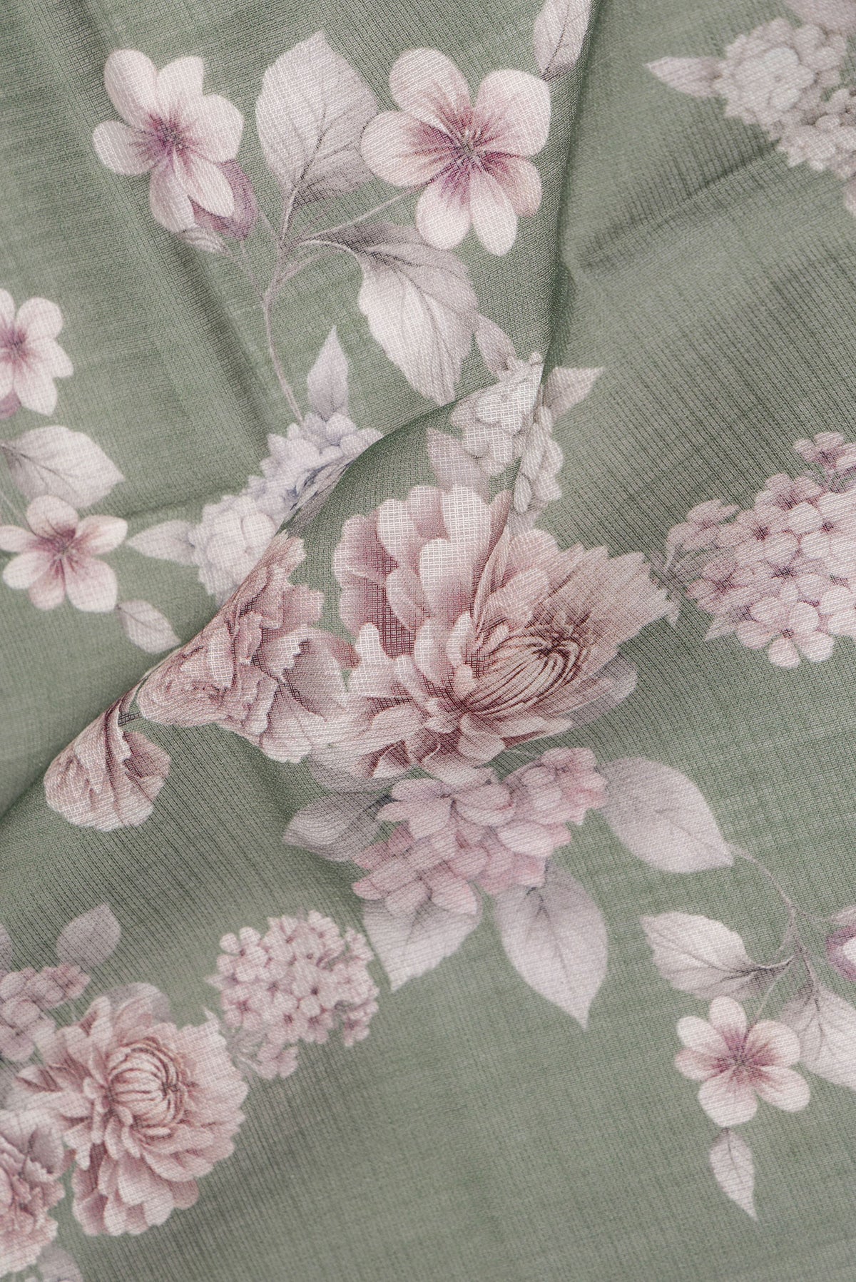 Close up of Pure Silk Green Kota Saree with Floral Print on the body and Thread Border.  displaying folds