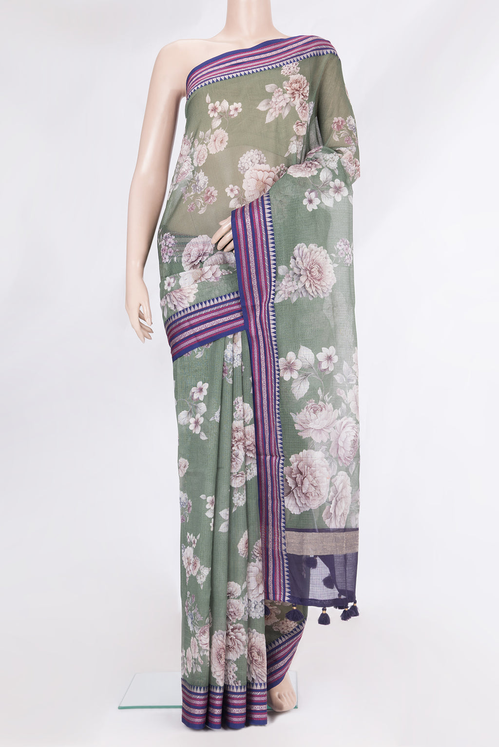 Pure Silk Green Kota Saree with Floral Print on the body and Thread Border.  displayed on a mannequin