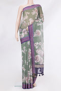 Pure Silk Green Kota Saree with Floral Print on the body and Thread Border.  displayed on a mannequin