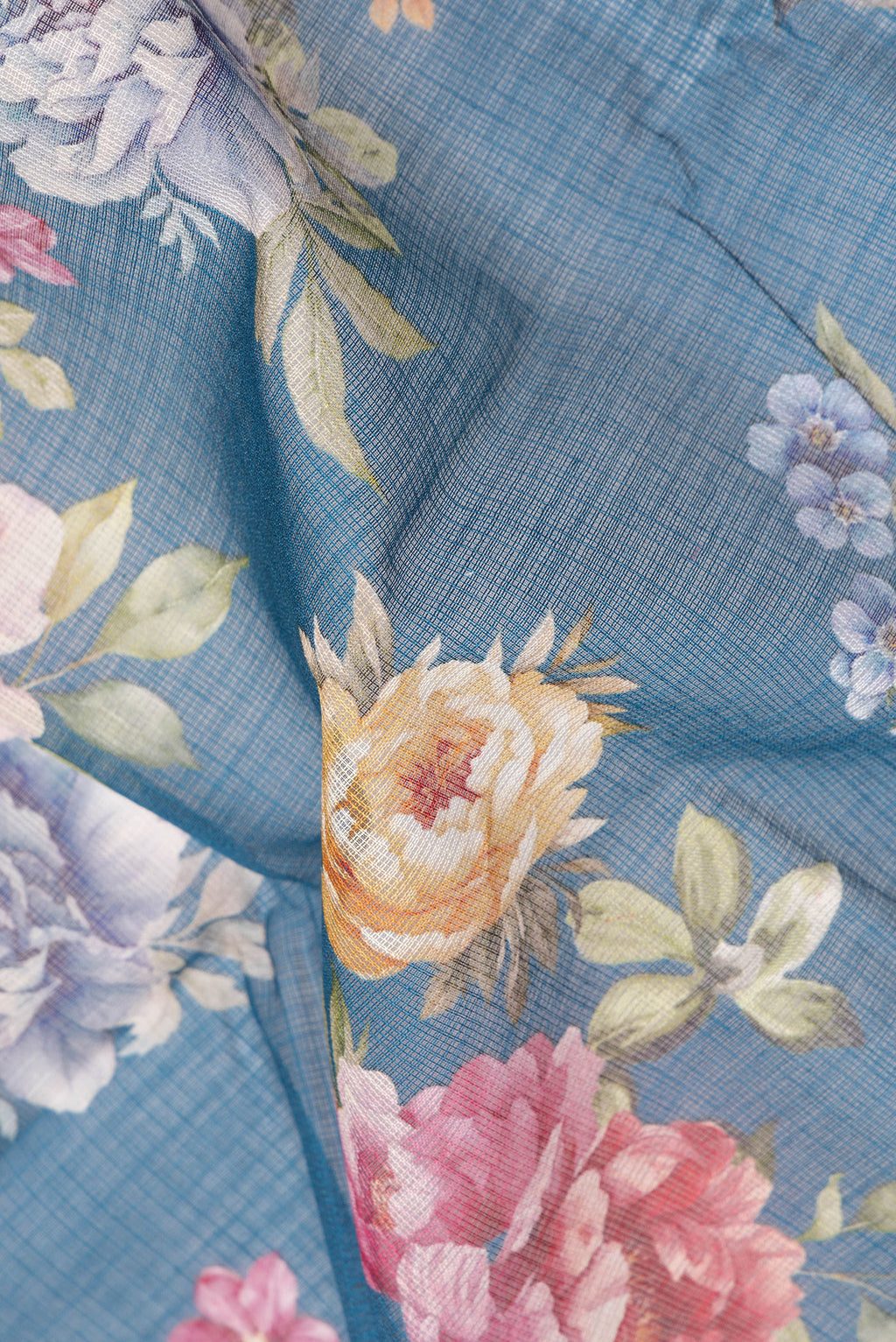 Close up of Pure Silk Peacock Blue Kota Saree with Floral Print on the body and Thread Border.  displaying folds