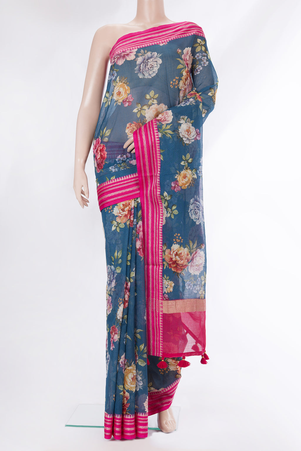 Pure Silk Peacock Blue Kota Saree with Floral Print on the body and Thread Border.  displayed on a mannequin