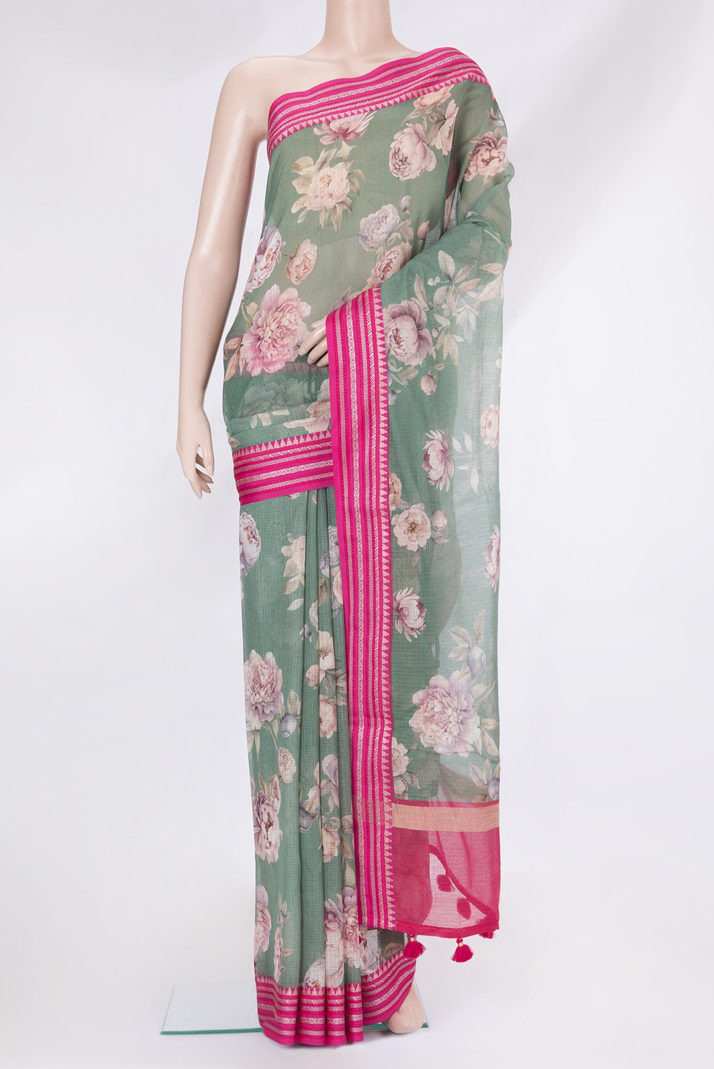 Green Kota Silk Saree with Printed design on the body and Thread Border.  displayed on a mannequin