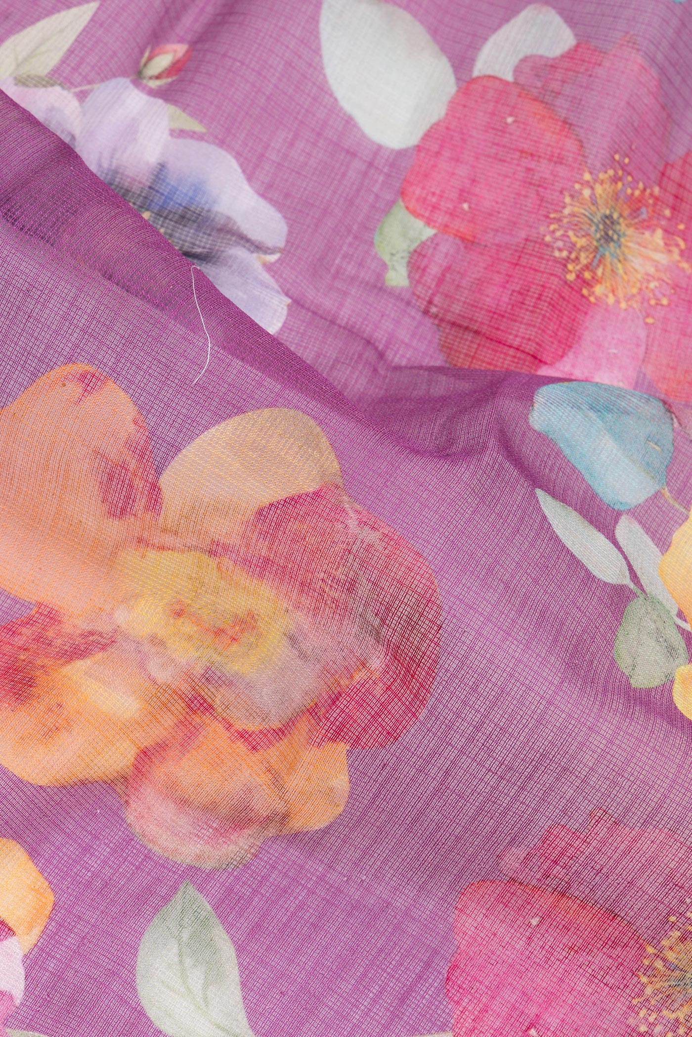 Close up of Purple Kota Silk Saree with Floral Print on the body and Thread Border.  displaying folds