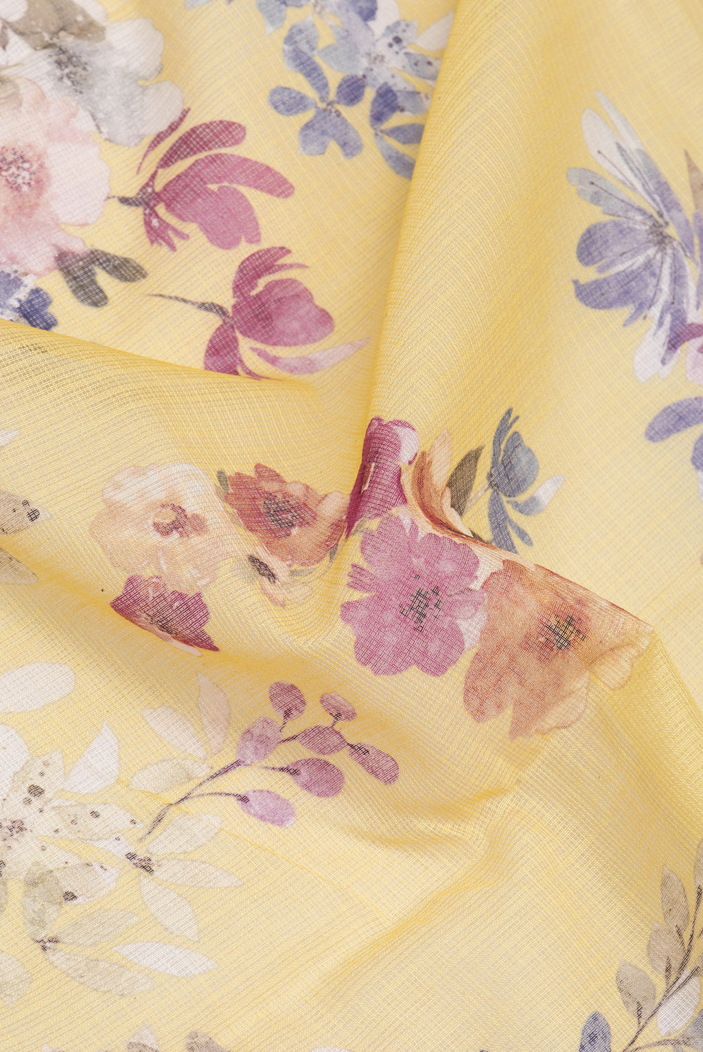 Close up of Yellow Kota Silk Saree with Floral Print on the body and Thread Border.  displaying folds