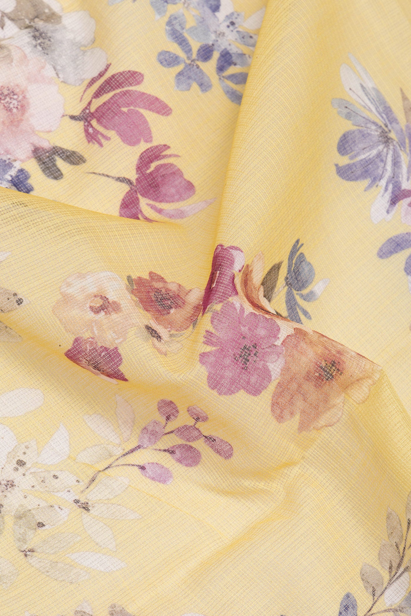 Close up of Yellow Kota Silk Saree with Floral Print on the body and Thread Border.  displaying folds