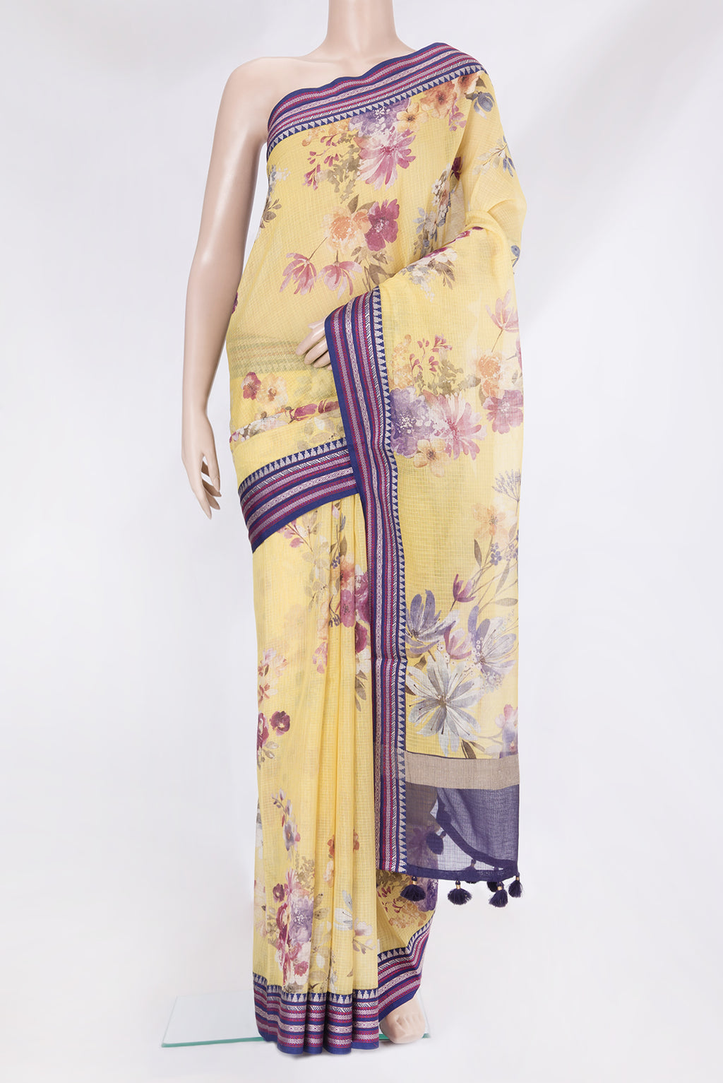 Yellow Kota Silk Saree with Floral Print on the body and Thread Border.  displayed on a mannequin