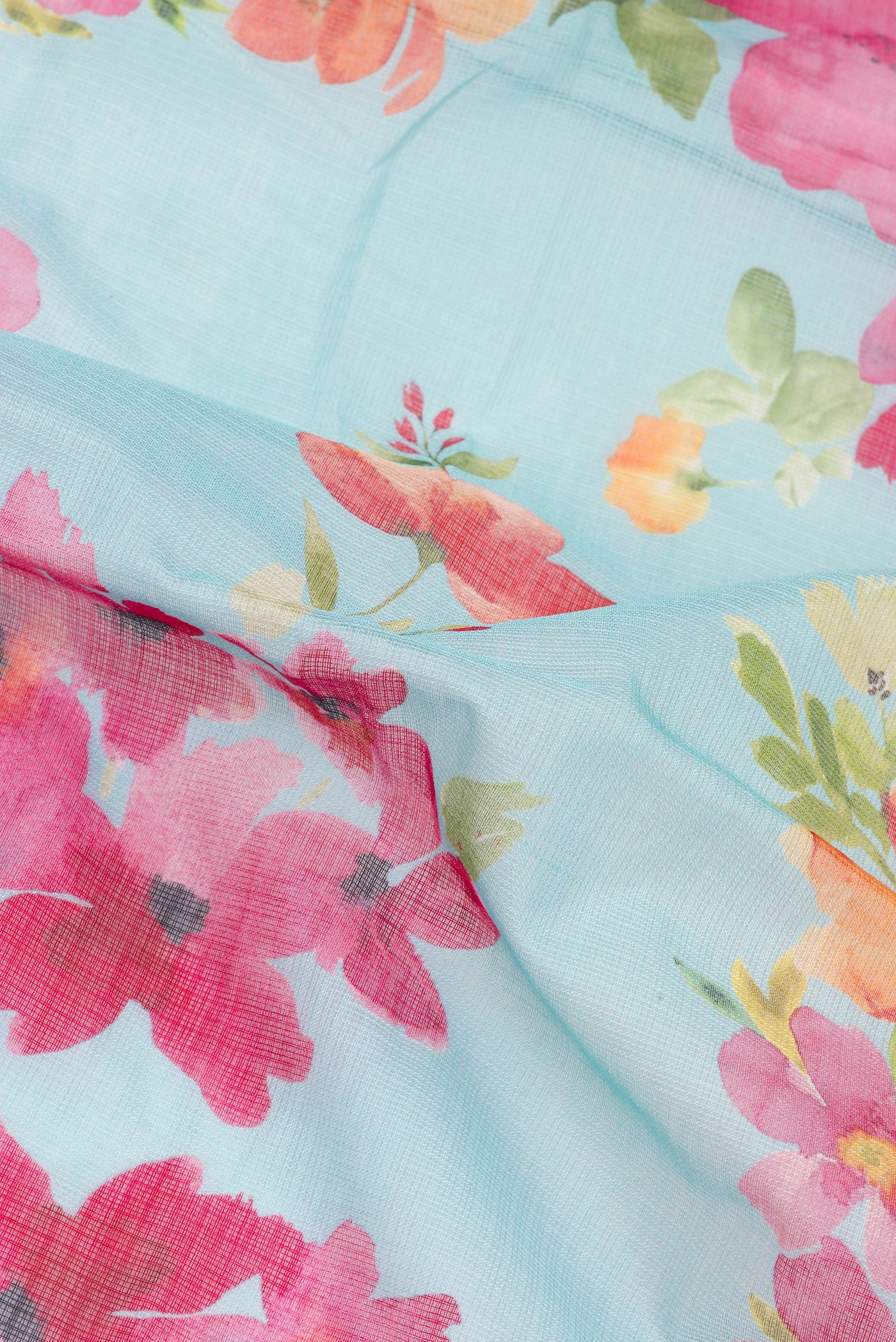 Close up of Light Blue Kota Silk Saree with Floral Print on the body and Thread Border.  displaying folds