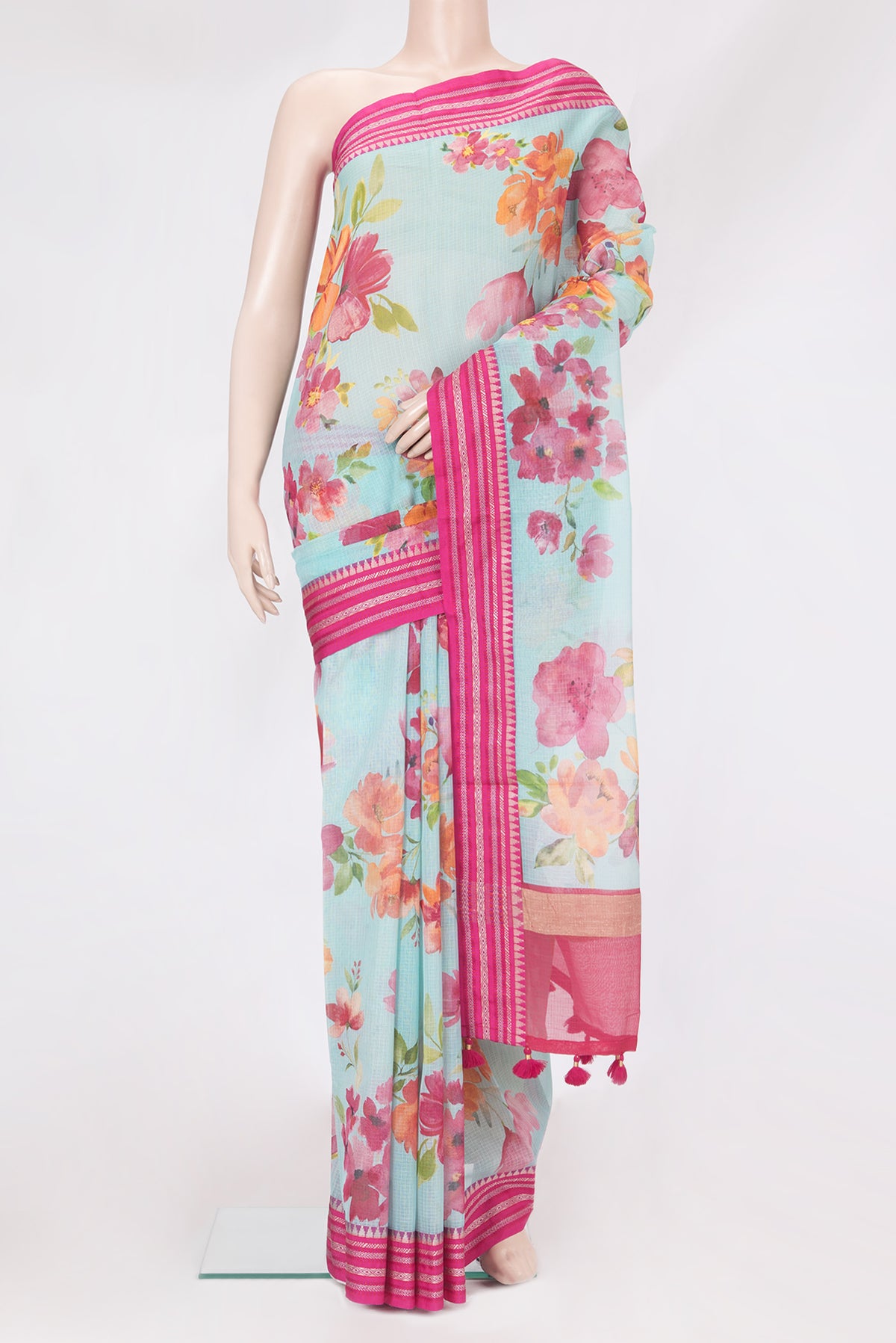 Light Blue Kota Silk Saree with Floral Print on the body and Thread Border.  displayed on a mannequin