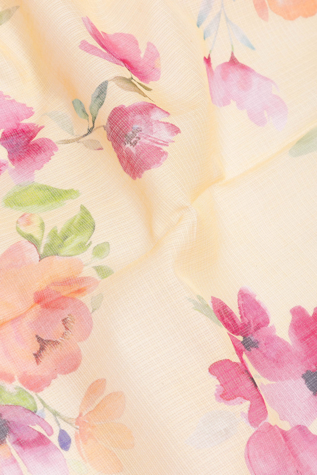 Close up of Yellow Kota Silk Saree with Printed design on the body and Thread Border.  displaying folds