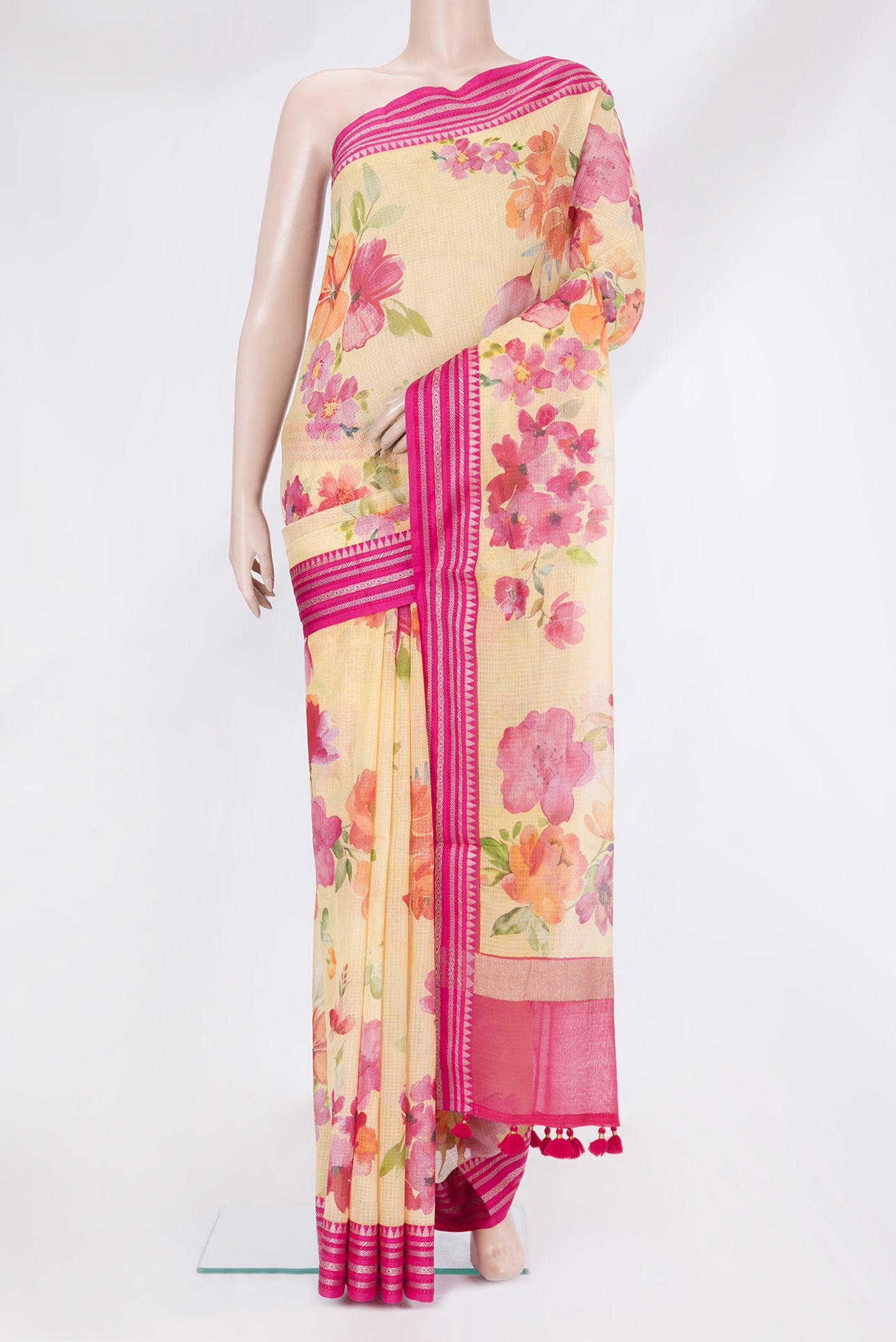 Yellow Kota Silk Saree with Printed design on the body and Thread Border.  displayed on a mannequin