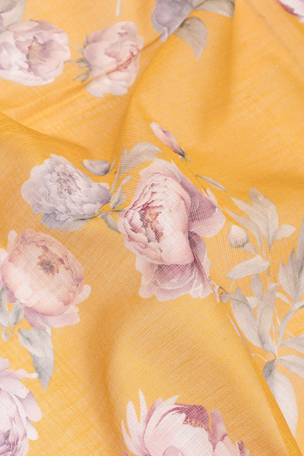 Close up of Yellow Dual Tone Kota Silk Saree with Floral Print on the body and Thread Border.  displaying folds