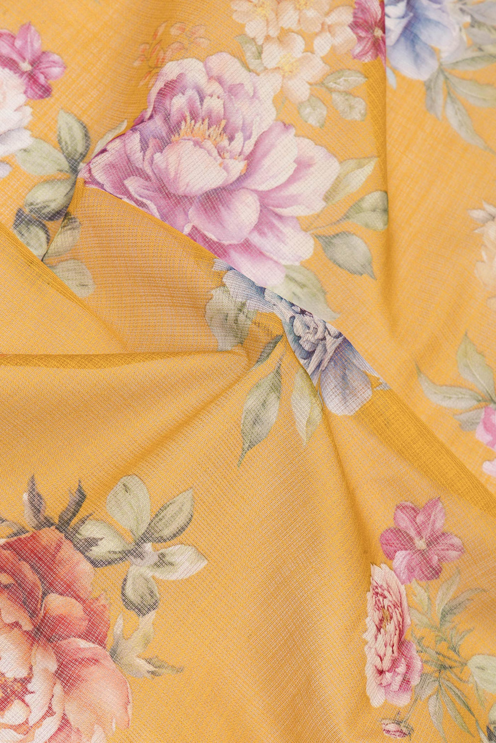 Close up of Mustard Kota Silk Saree with Floral Print on the body and Thread Border.  displaying folds