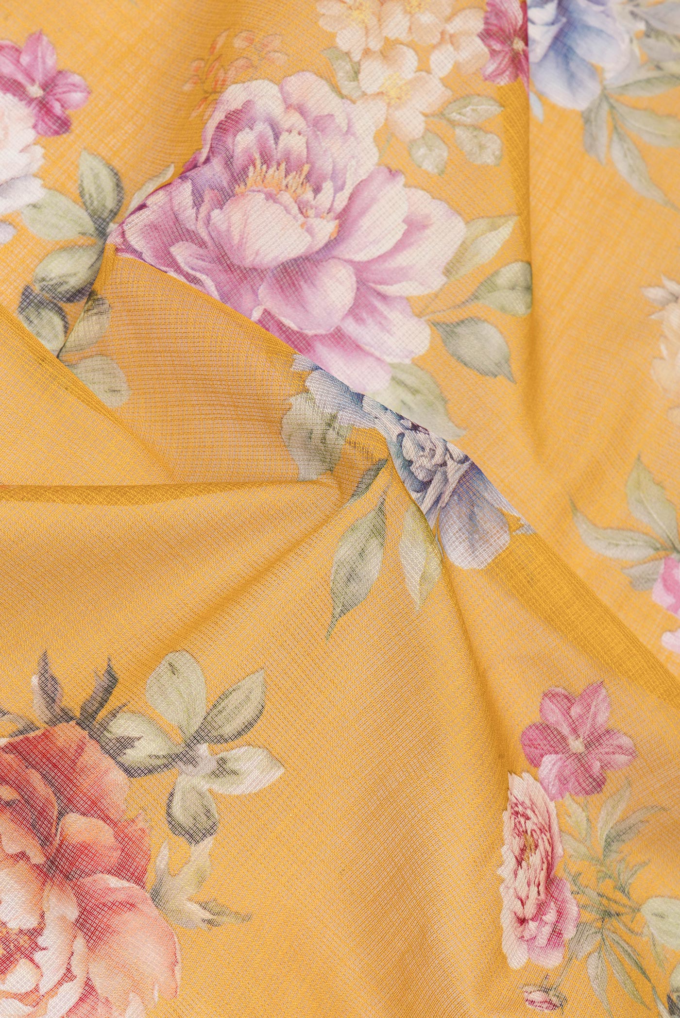 Close up of Mustard Kota Silk Saree with Floral Print on the body and Thread Border.  displaying folds