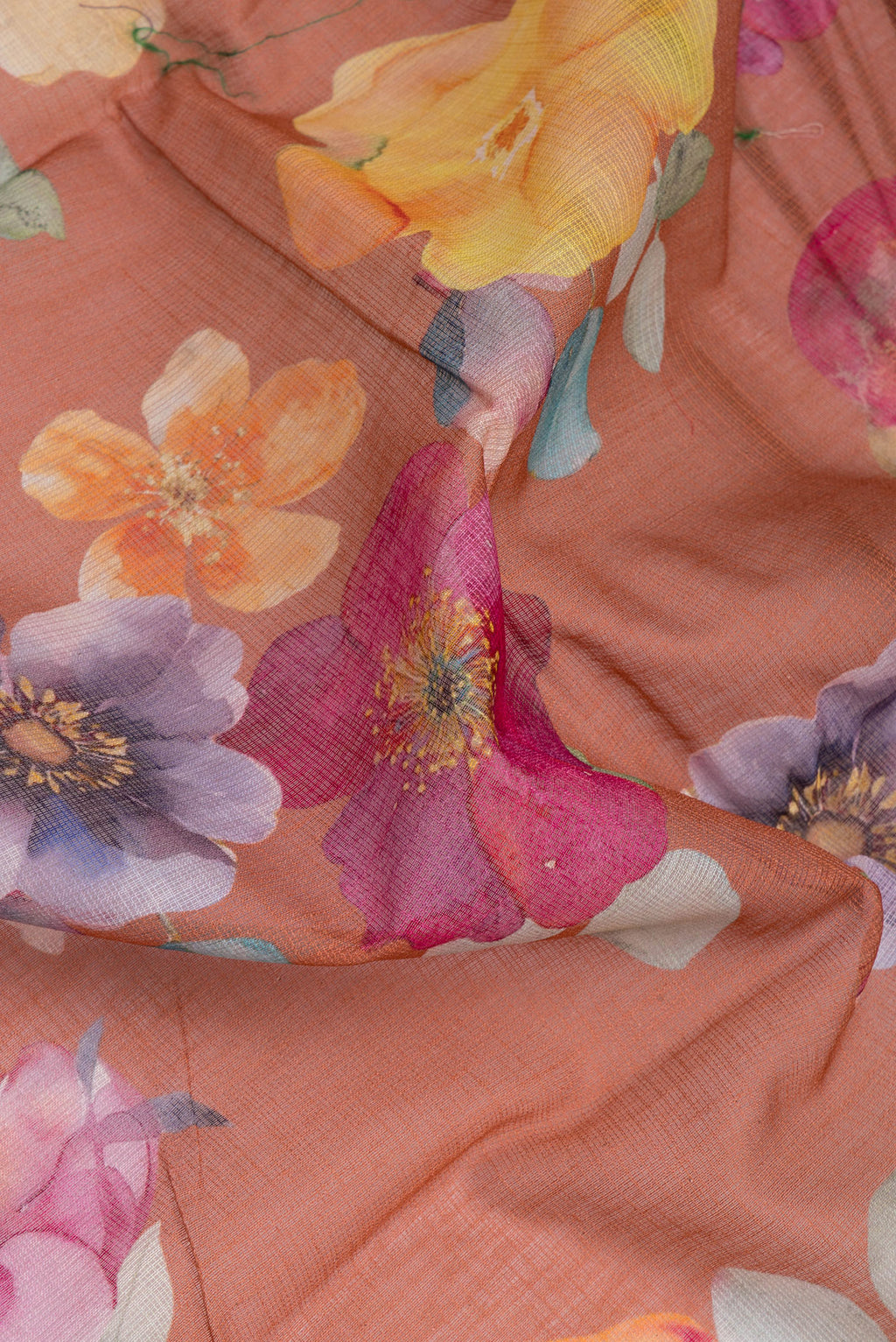 Close up of Brown Kota Silk Saree with Floral Print on the body and Thread Border.  displaying folds