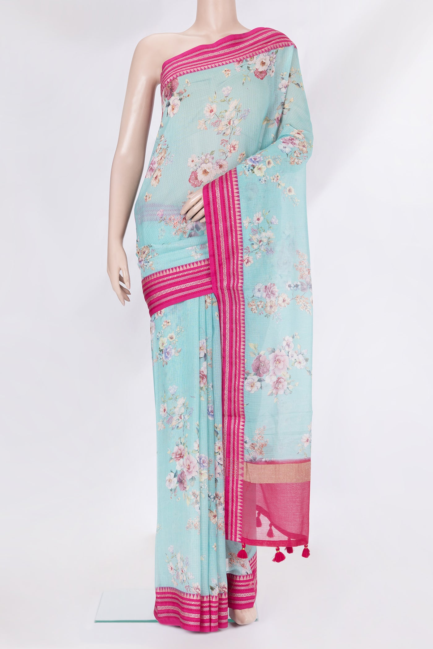 Sky Blue Kota Silk Saree with Floral Print on the body and Thread Border.  displayed on a mannequin