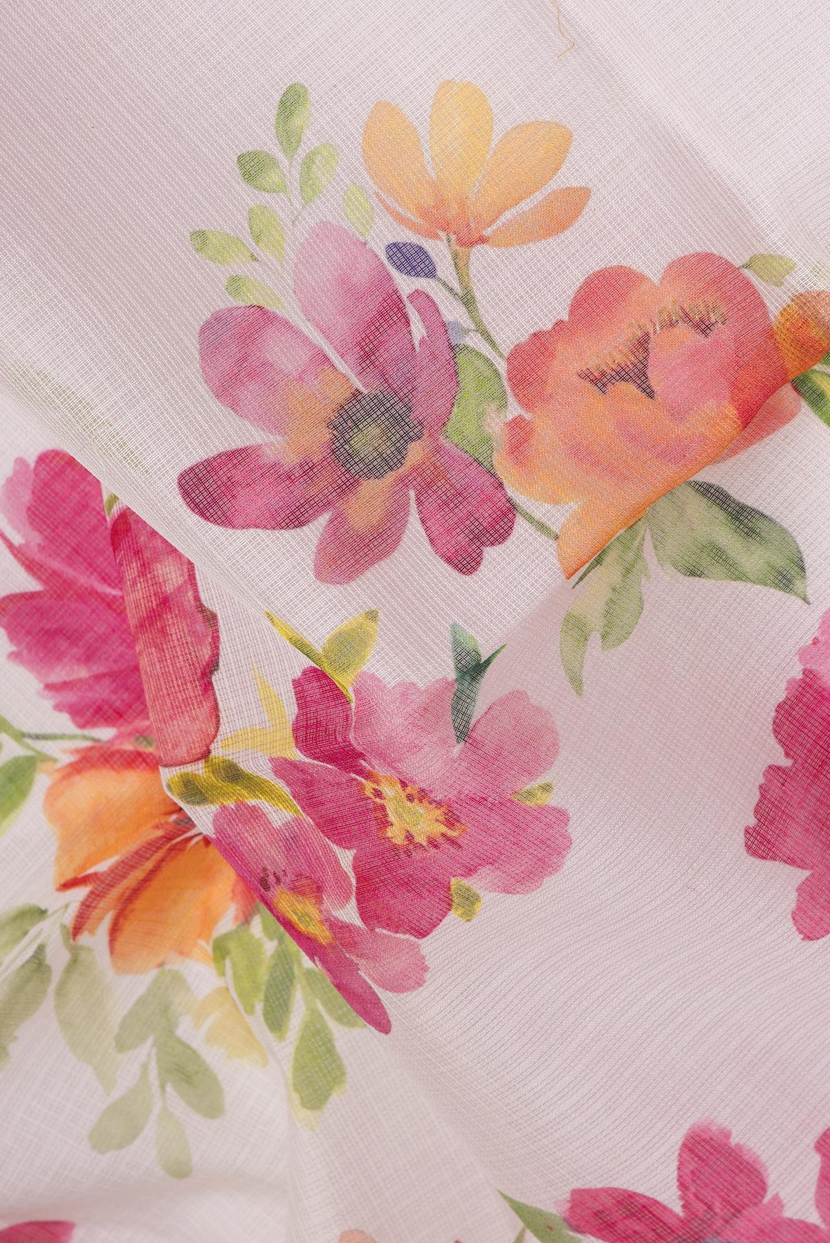 Close up of Beige Kota Silk Saree with Floral Print on the body and Thread Border.  displaying folds