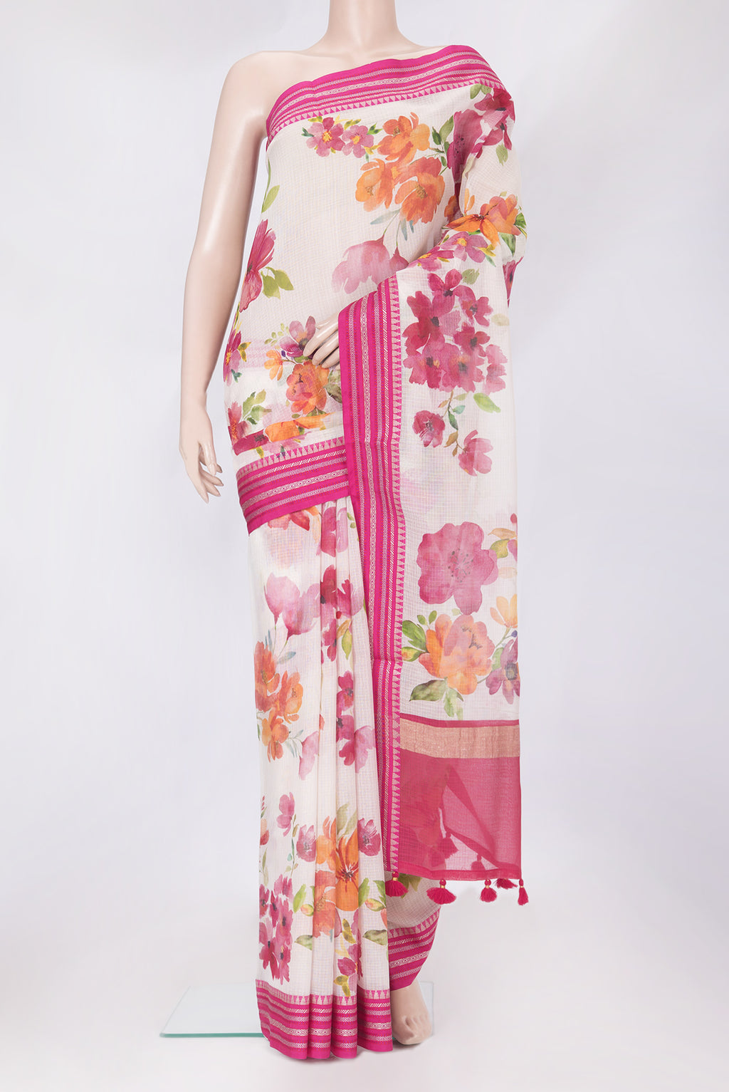 Beige Kota Silk Saree with Floral Print on the body and Thread Border.  displayed on a mannequin