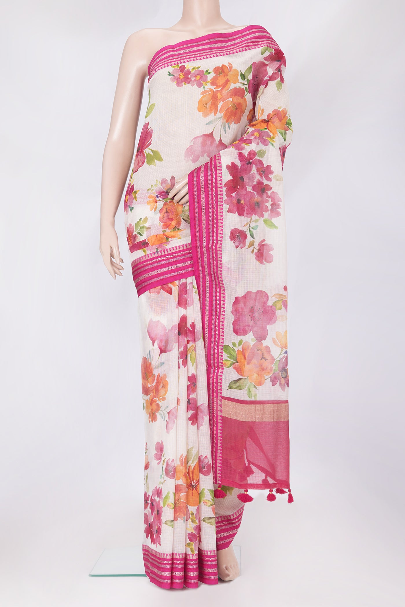 Beige Kota Silk Saree with Floral Print on the body and Thread Border.  displayed on a mannequin