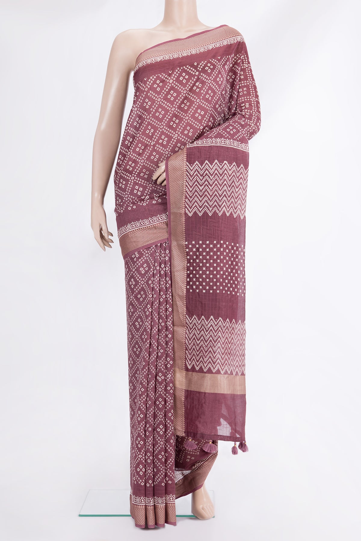 Mauve Chanderi Cotton Saree with Bandhani Print on the body and Thread Border.  displayed on a mannequin