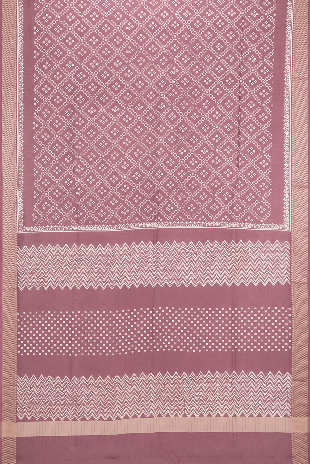 Flat view of Mauve Chanderi Cotton Saree with Bandhani Print on the body and Thread Border. 