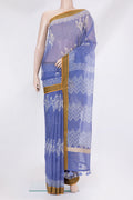 Blue Kota Silk Saree with Floral Print on the body and Thread Border.  displayed on a mannequin