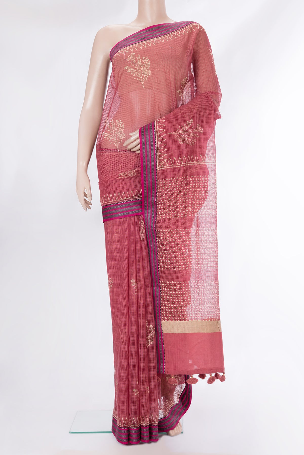 Pure Silk Peach Kota Saree with Printed design on the body and Thread Border.  displayed on a mannequin