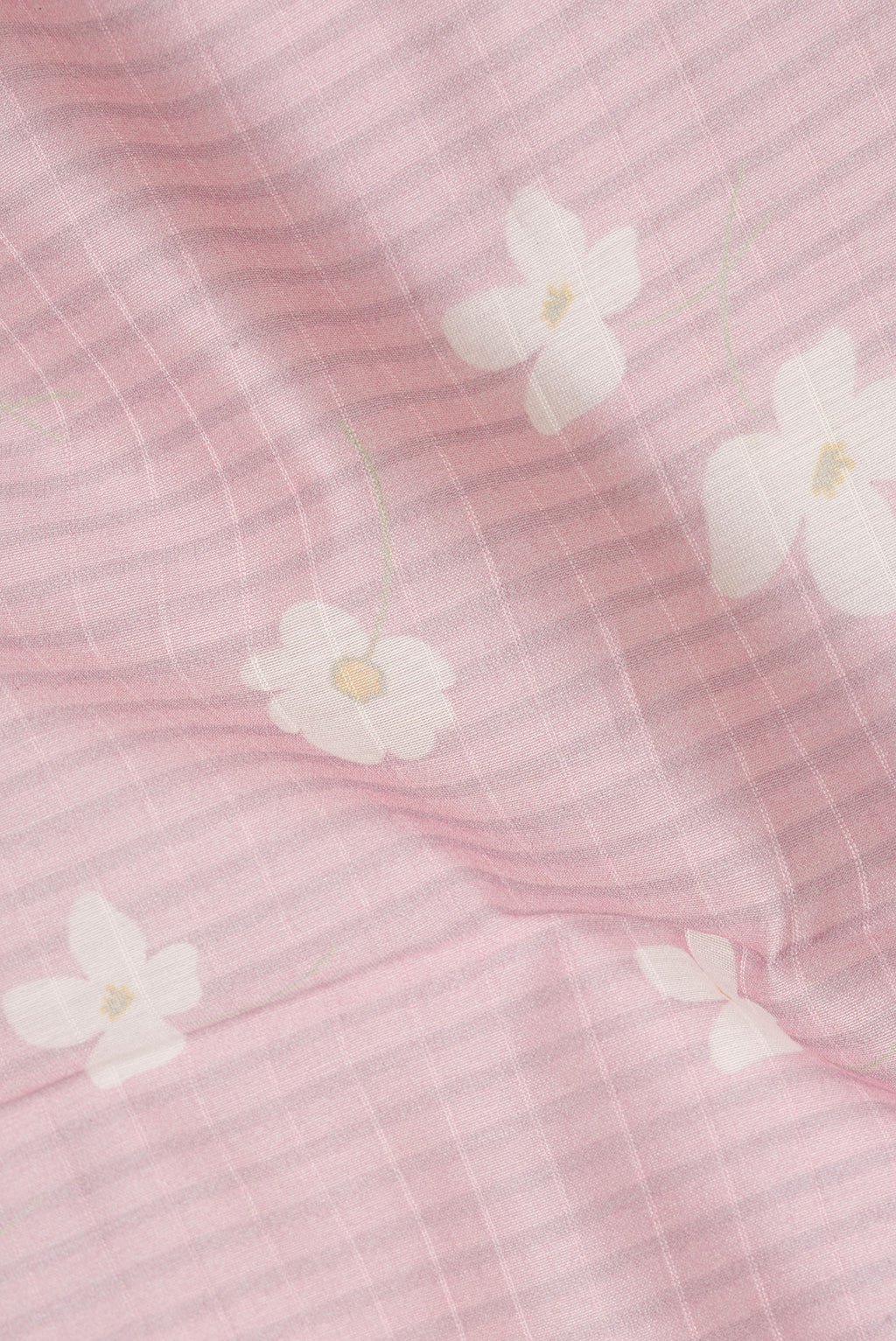 Close up of Pure Silk Pink Dual Tone Chanderi Saree with Printed design on the body and Zari And Thread Border.  displaying folds