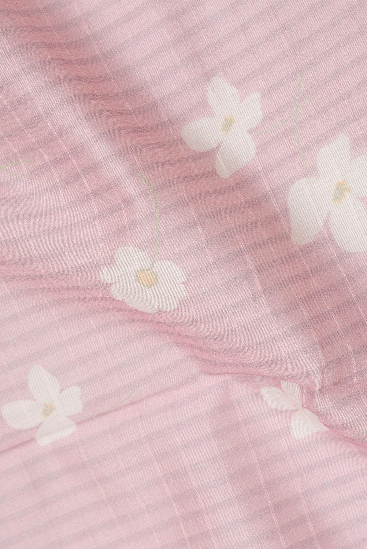 Close up of Pure Silk Pink Dual Tone Chanderi Saree with Printed design on the body and Zari And Thread Border.  displaying folds