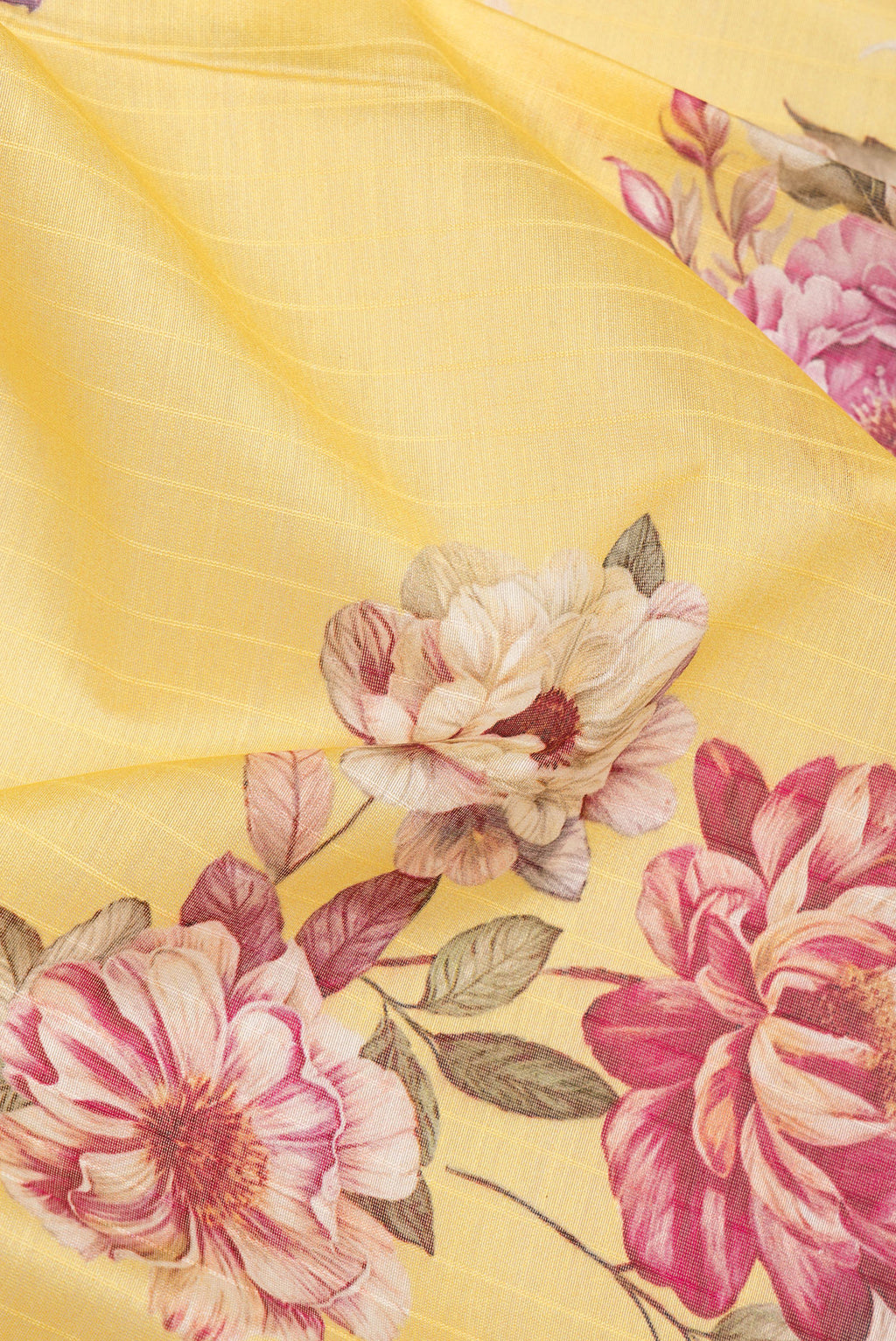 Close up of Pure Silk Lemon Yellow Dual Tone Chanderi Saree with Printed design on the body and Zari And Thread Border.  displaying folds