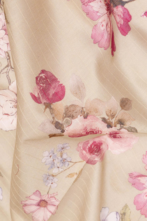 Close up of Beige Chanderi Cotton Saree with Floral Print on the body and Zari And Thread Border.  displaying folds