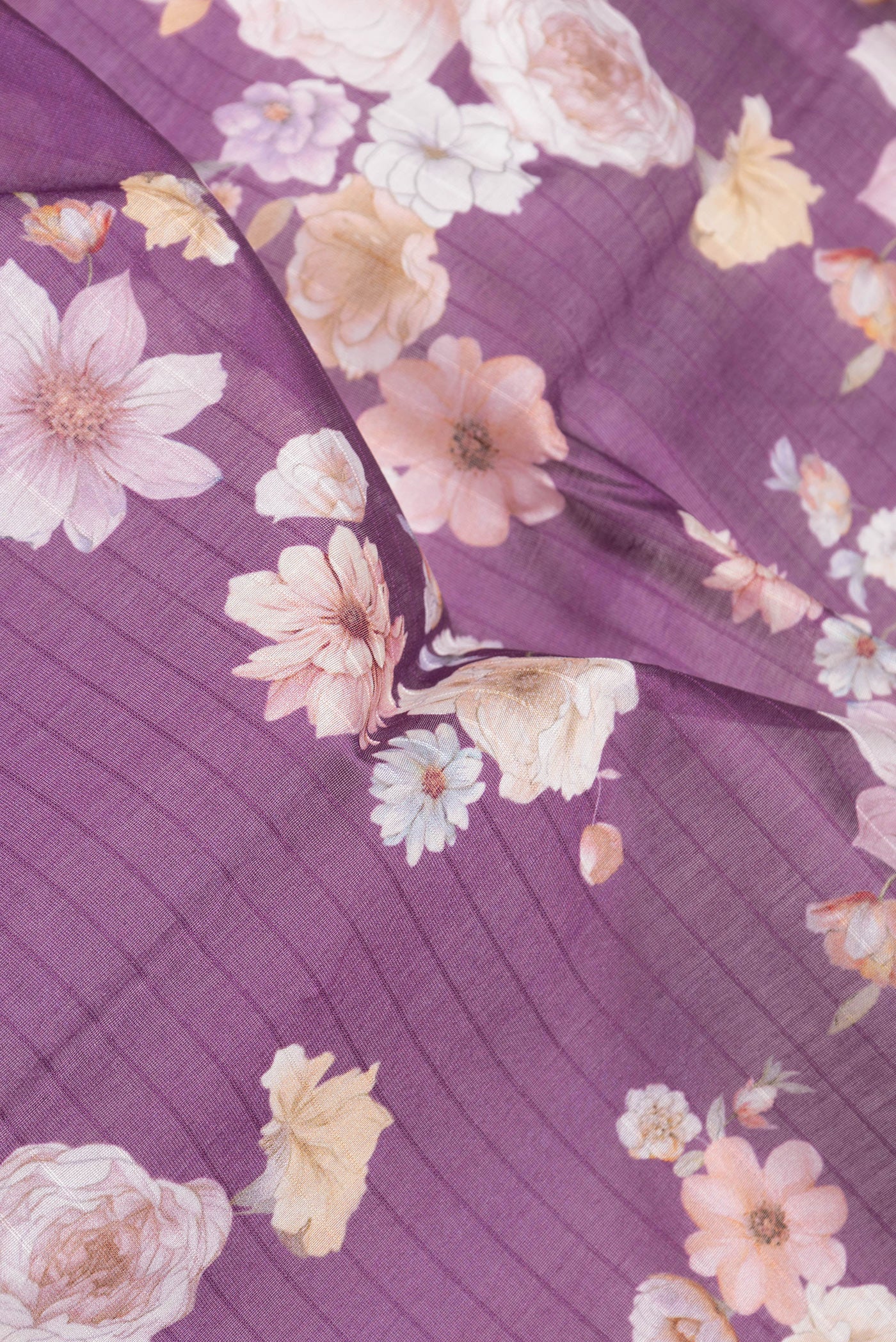 Close up of Purple Dual Tone Chanderi Silk Saree with Printed design on the body and Zari Border.  displaying folds