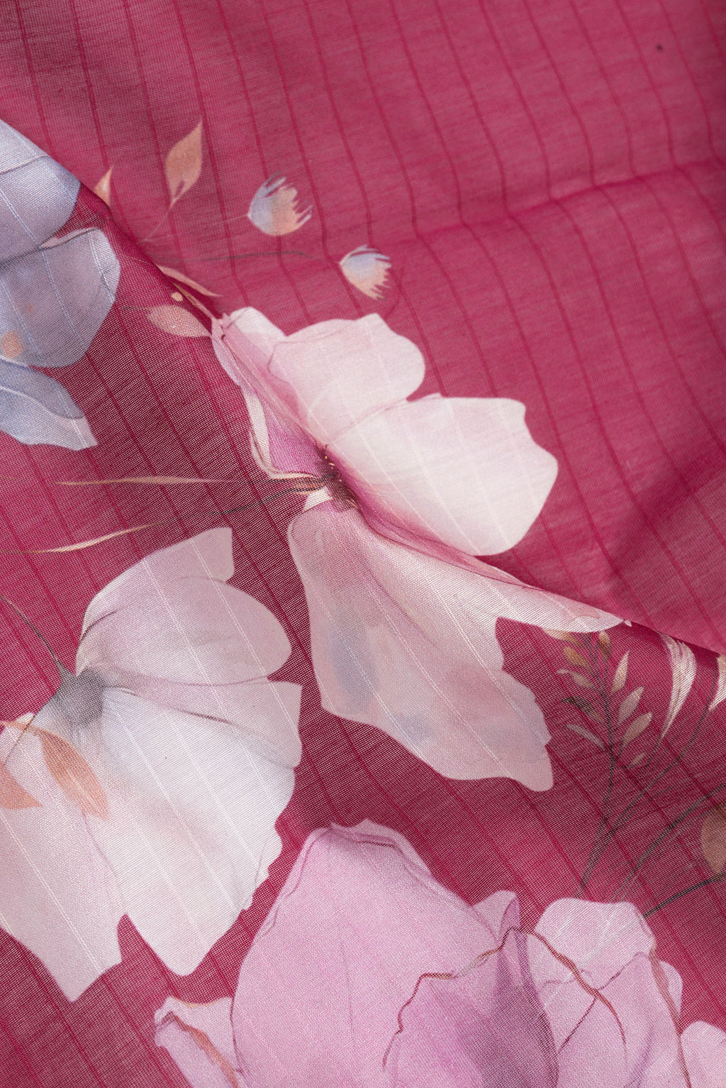 Close up of Pink Dual Tone Chanderi Silk Cotton Saree with Printed design on the body and Zari And Thread Border.  displaying folds