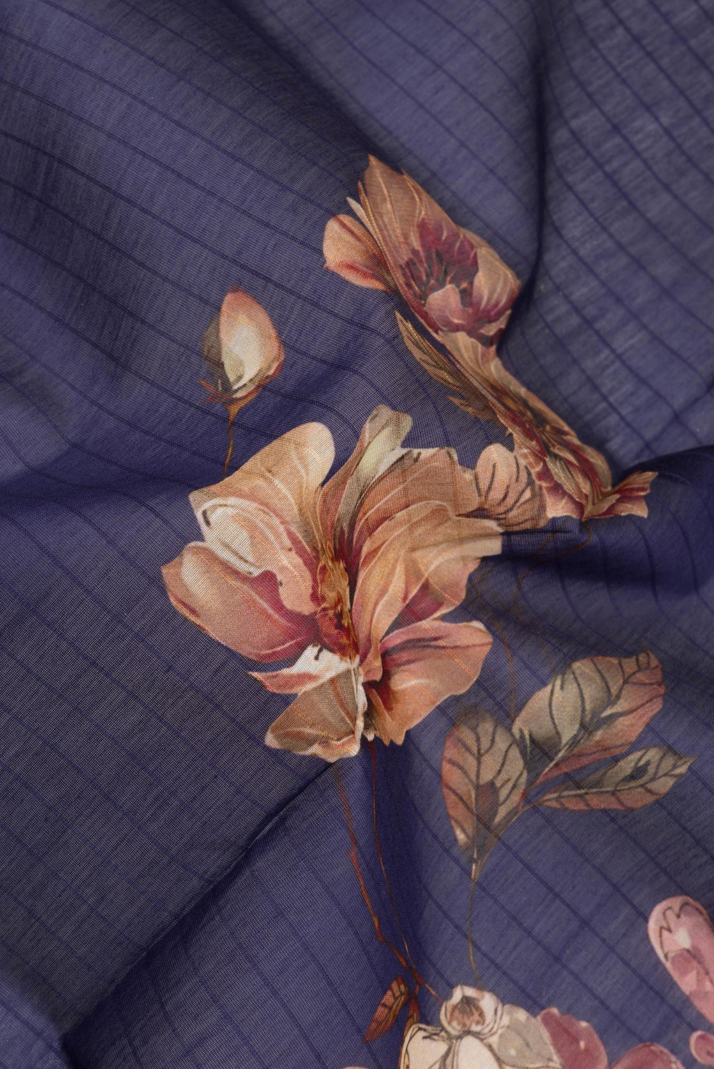 Close up of Pure Silk Navy Blue Dual Tone Chanderi Saree with Printed design on the body and Zari And Thread Border.  displaying folds