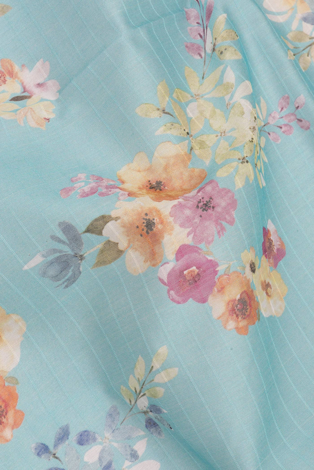 Close up of Pure Silk Sky Blue Dual Tone Chanderi Saree with Printed design on the body and Zari And Thread Border.  displaying folds