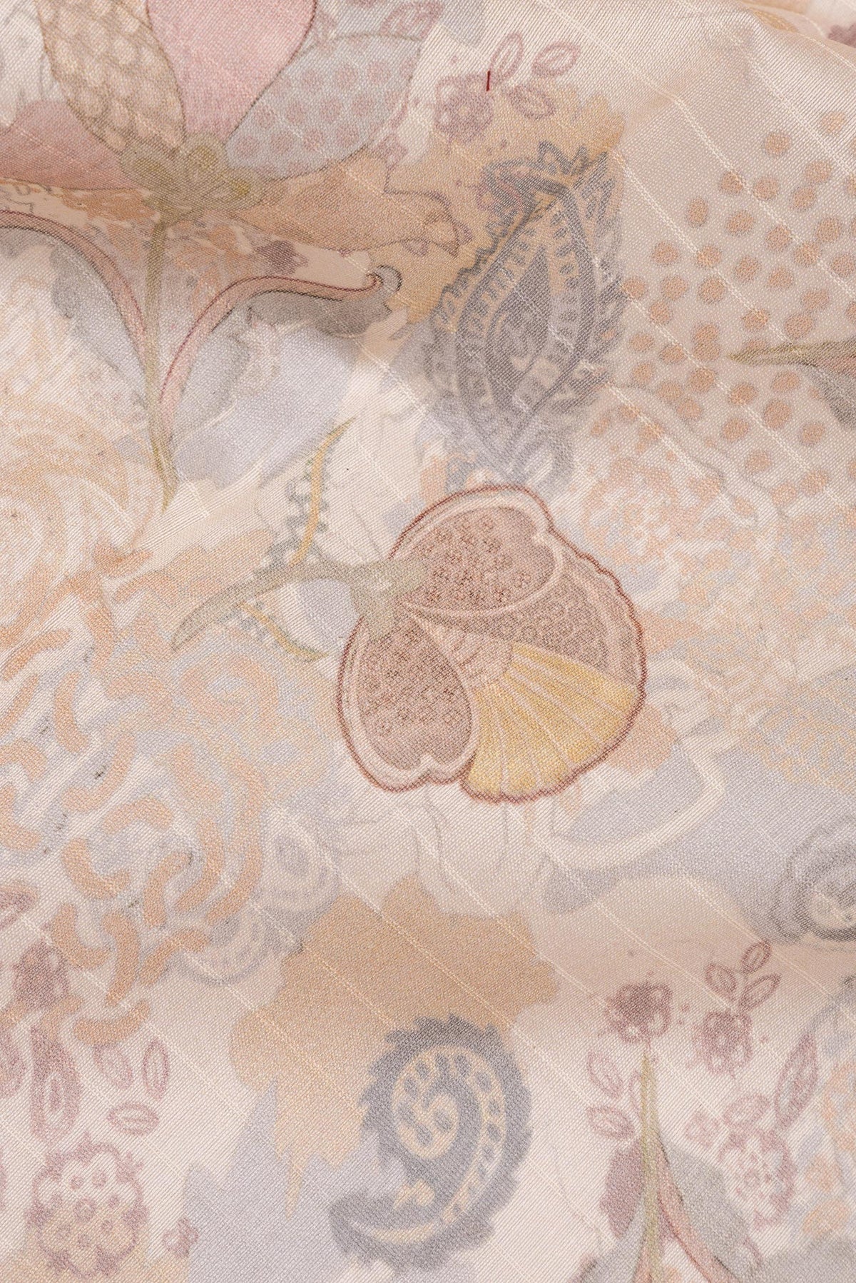 Close up of Pure Silk Beige Dual Tone Chanderi Saree with Printed design on the body and Zari And Thread Border.  displaying folds