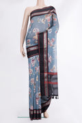 Light Blue Chanderi Cotton Saree with Floral Print on the body and Zari And Thread Border.  displayed on a mannequin