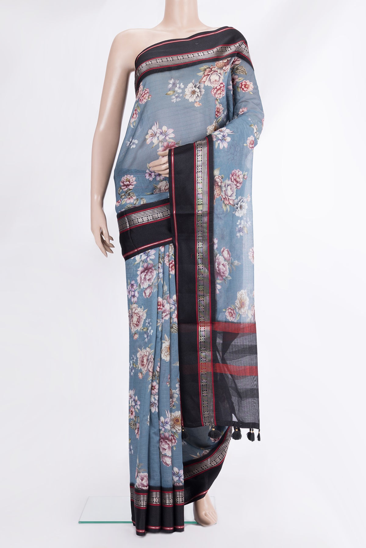 Light Blue Chanderi Cotton Saree with Floral Print on the body and Zari And Thread Border.  displayed on a mannequin