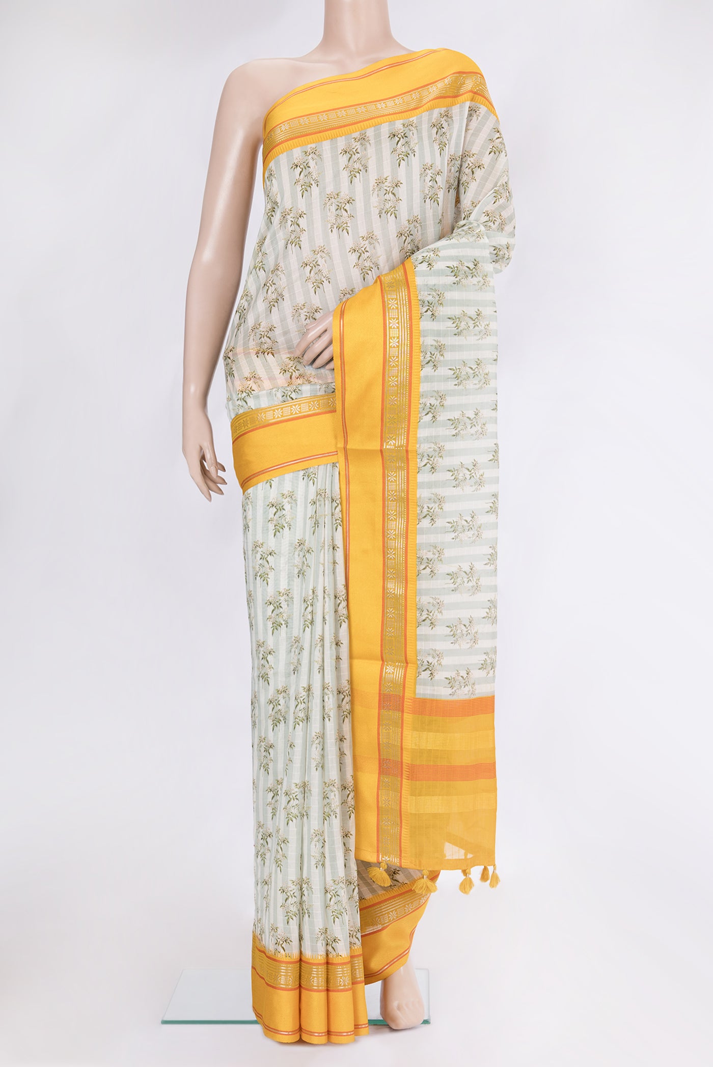 Green Dual Tone Chanderi Silk Saree with Printed design on the body and Zari And Thread Border.  displayed on a mannequin