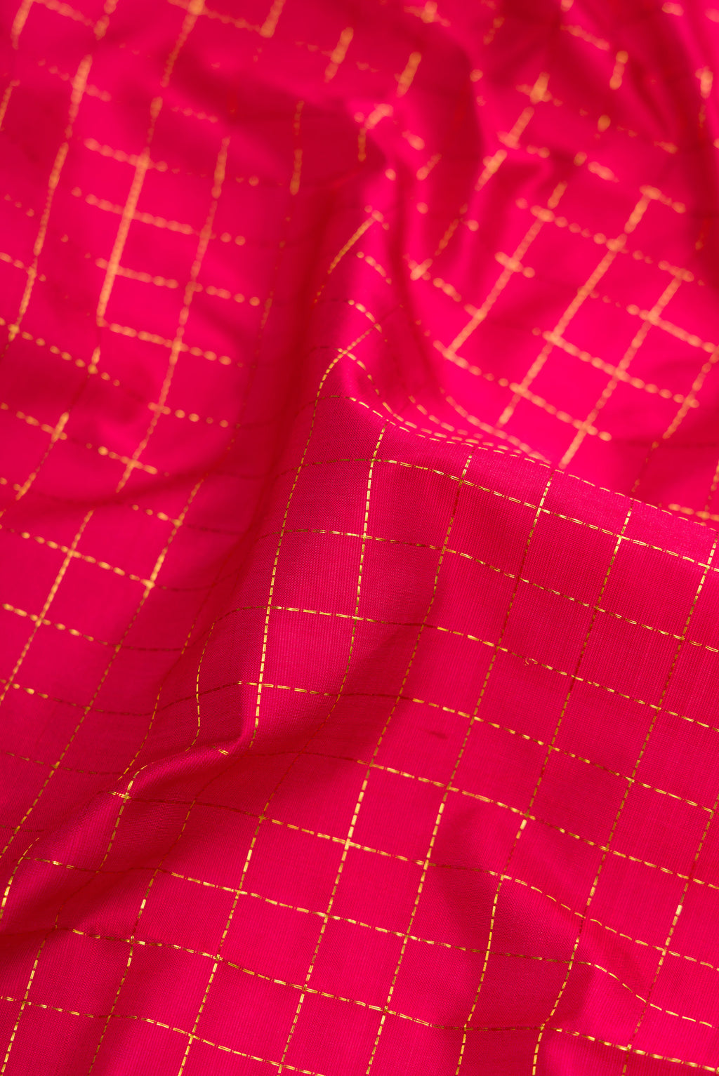 Close up of Maroon Dual Tone Kanchipuram Silk Nine Yards Saree with Checked design on the body and Zari Border.  displaying folds
