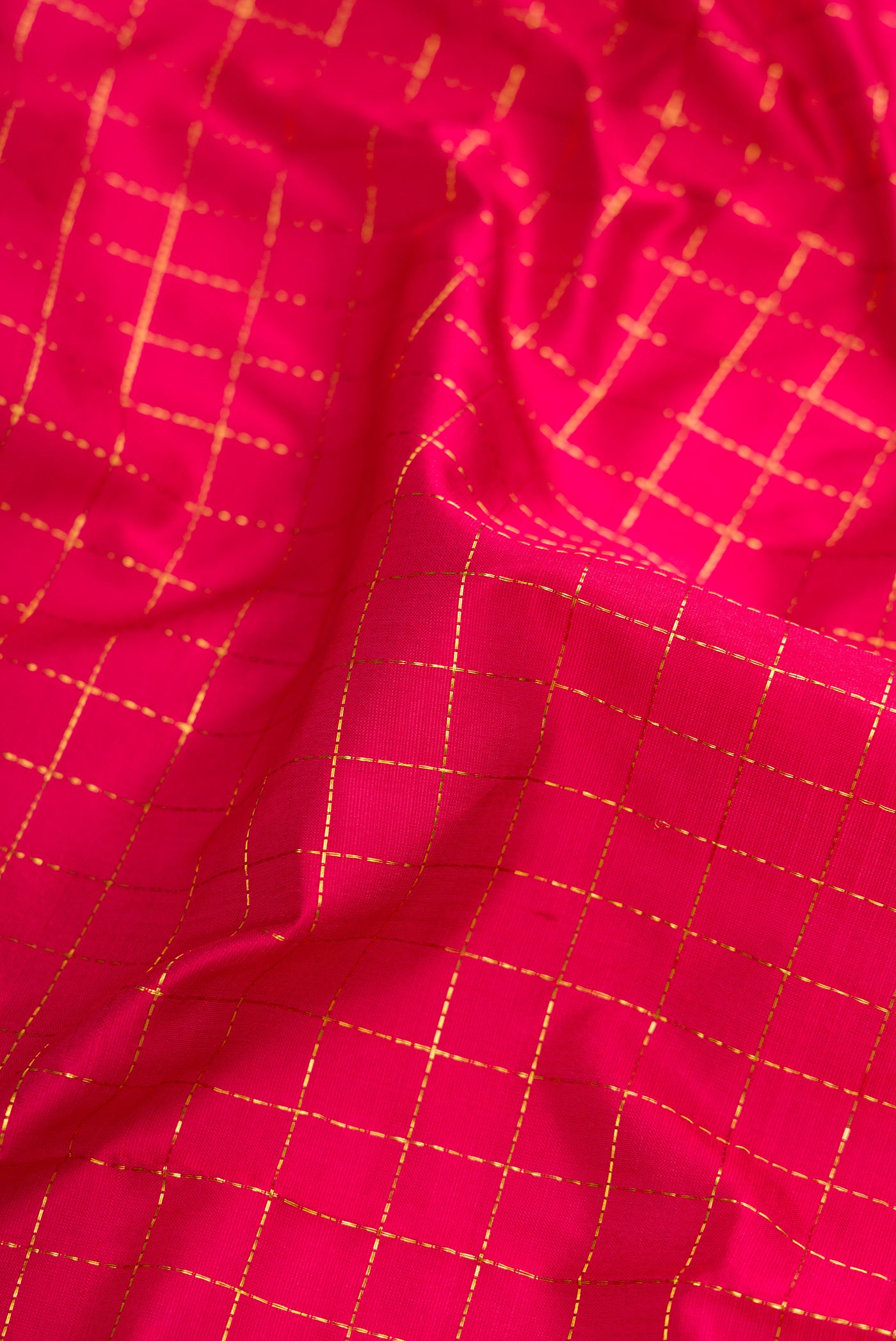 Close up of Maroon Dual Tone Kanchipuram Silk Nine Yards Saree with Checked design on the body and Zari Border.  displaying folds