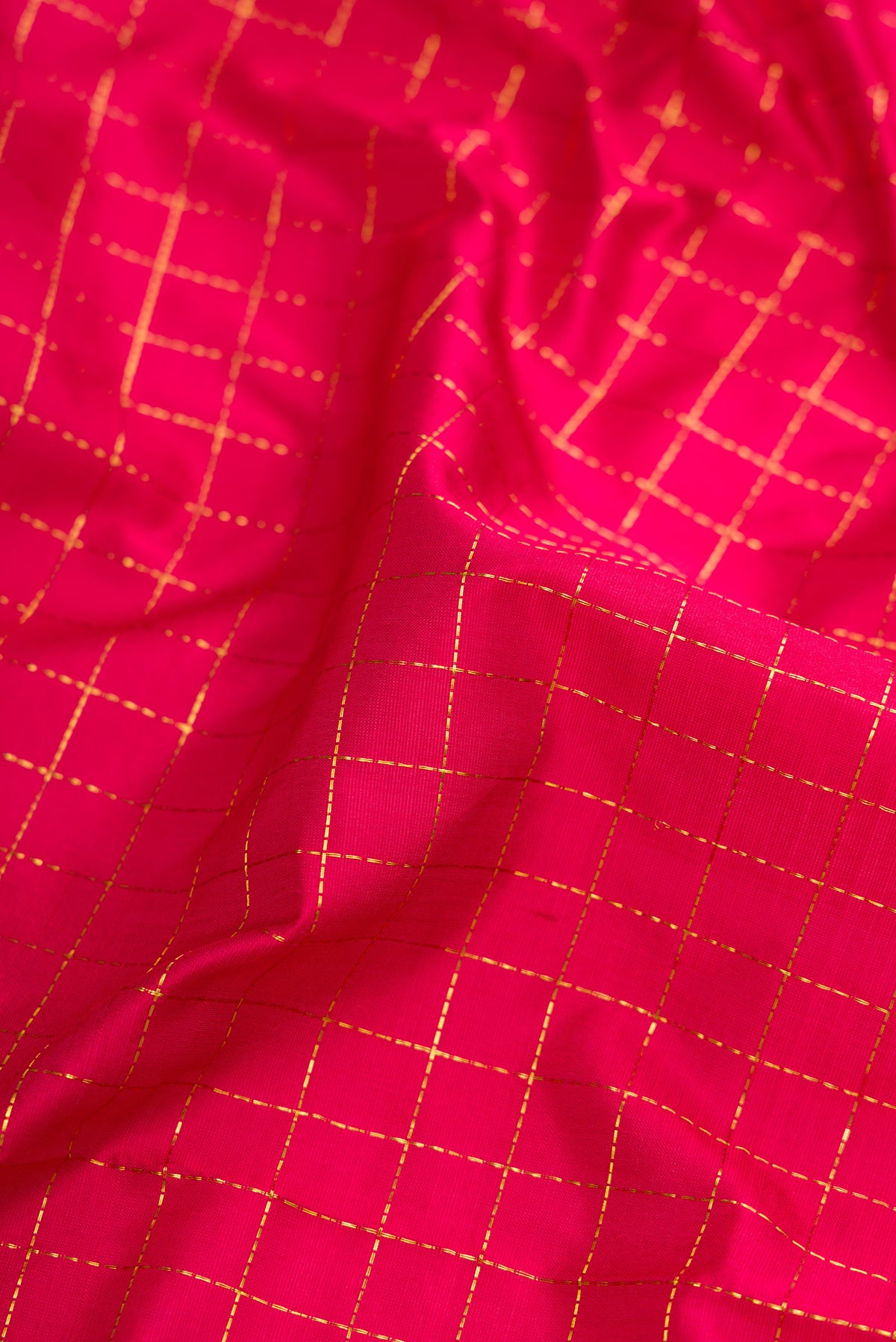 Close up of Maroon Dual Tone Kanchipuram Silk Nine Yards Saree with Checked design on the body and Zari Border.  displaying folds