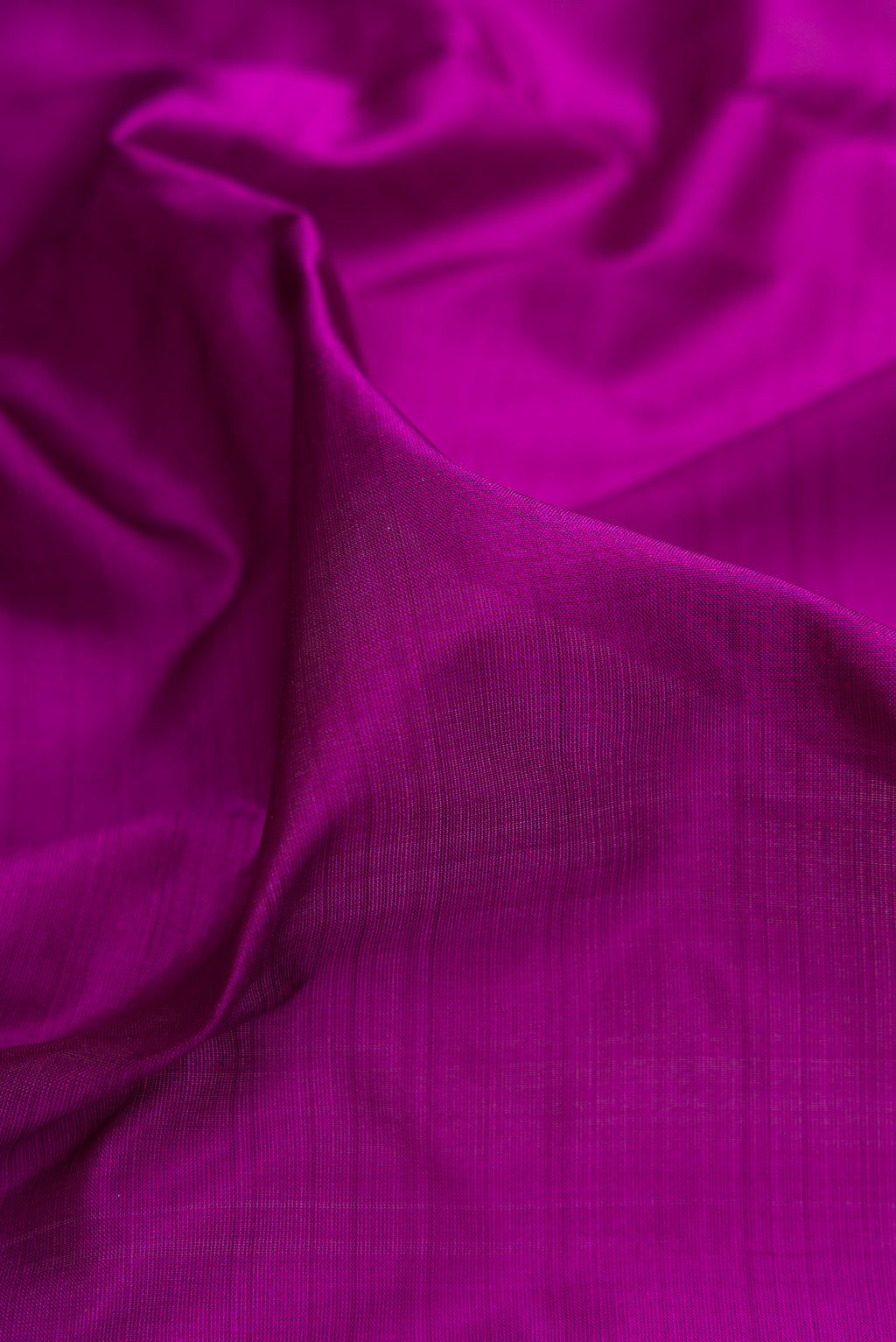 Close up of Pure Silk Purple Kanjivaram Nine Yards Saree with Plain Body and Zari Border.  displaying folds