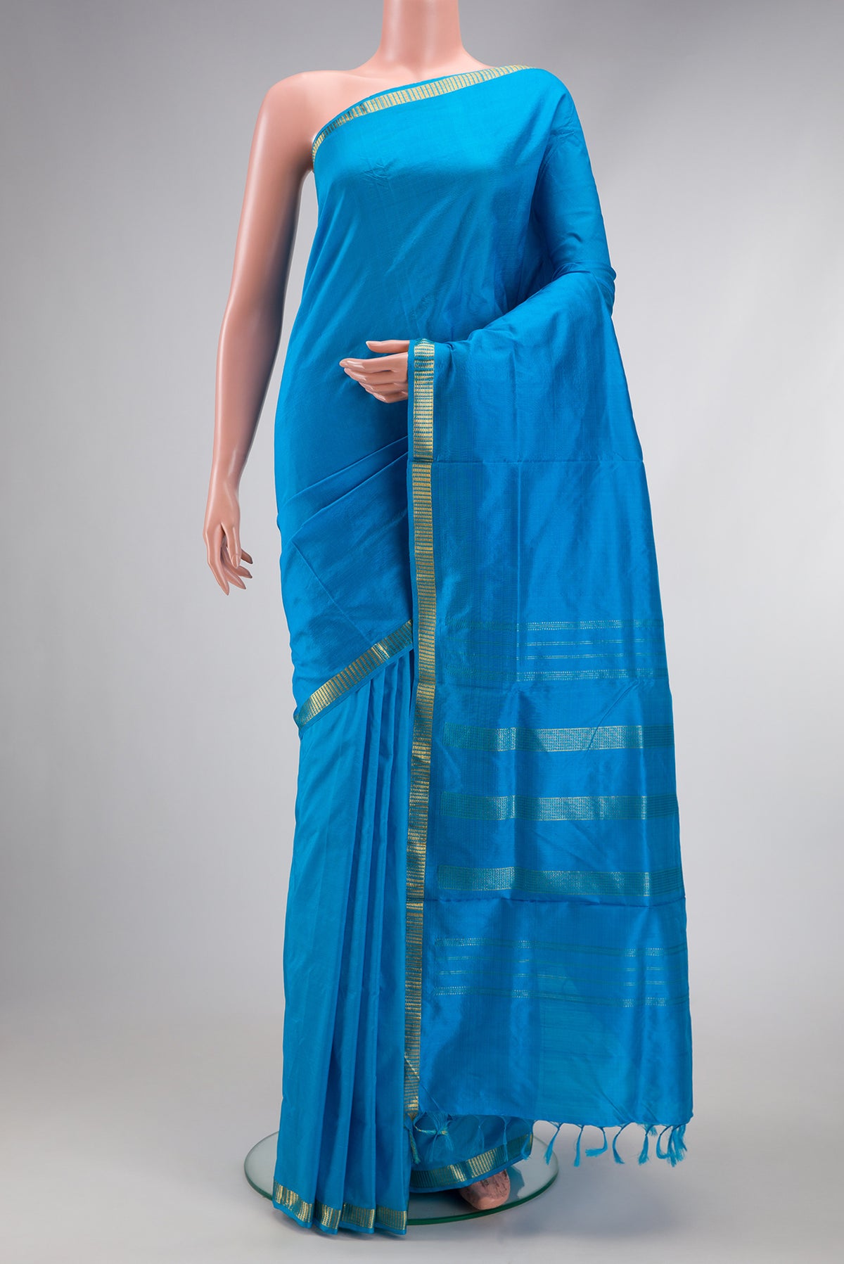 Blue Kanjivaram Silk Nine Yards Saree with Plain Body and Zari Border.  displayed on a mannequin